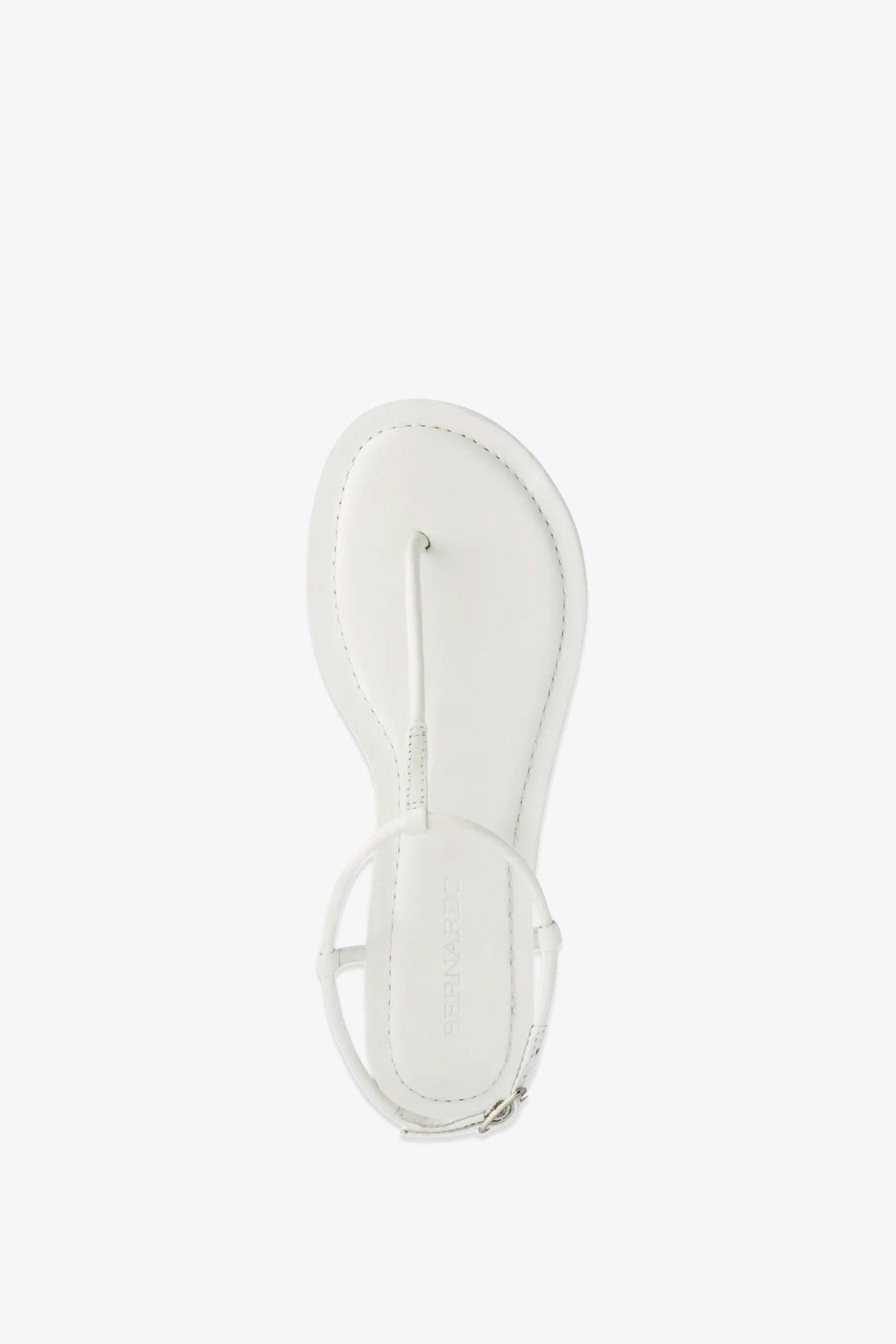 The Hercu Sandal is displayed from an overhead view, showcasing its minimalist white thong design with an ankle strap against a clean white background.