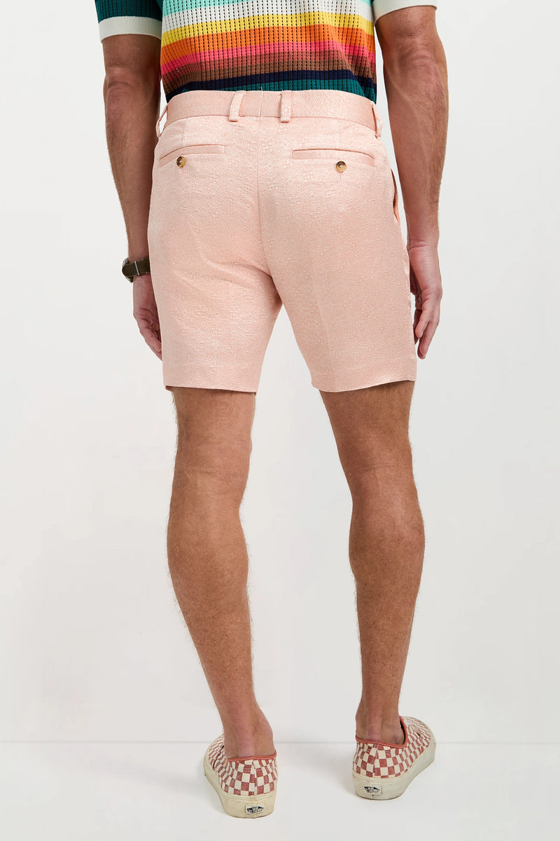 A man stands facing away, wearing the Clyde Short - Metallic Jacquard. Only his legs and lower back are visible.