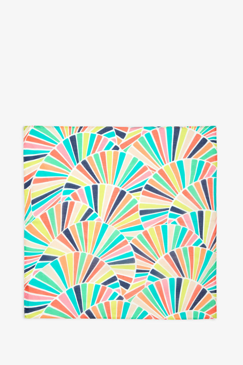 COTTON BANDANA featuring a vibrant repeating pattern of semi-circular fan shapes in shades of orange, teal, yellow, blue, and pink on a white background, crafted from 100% cotton for a soft and durable finish.