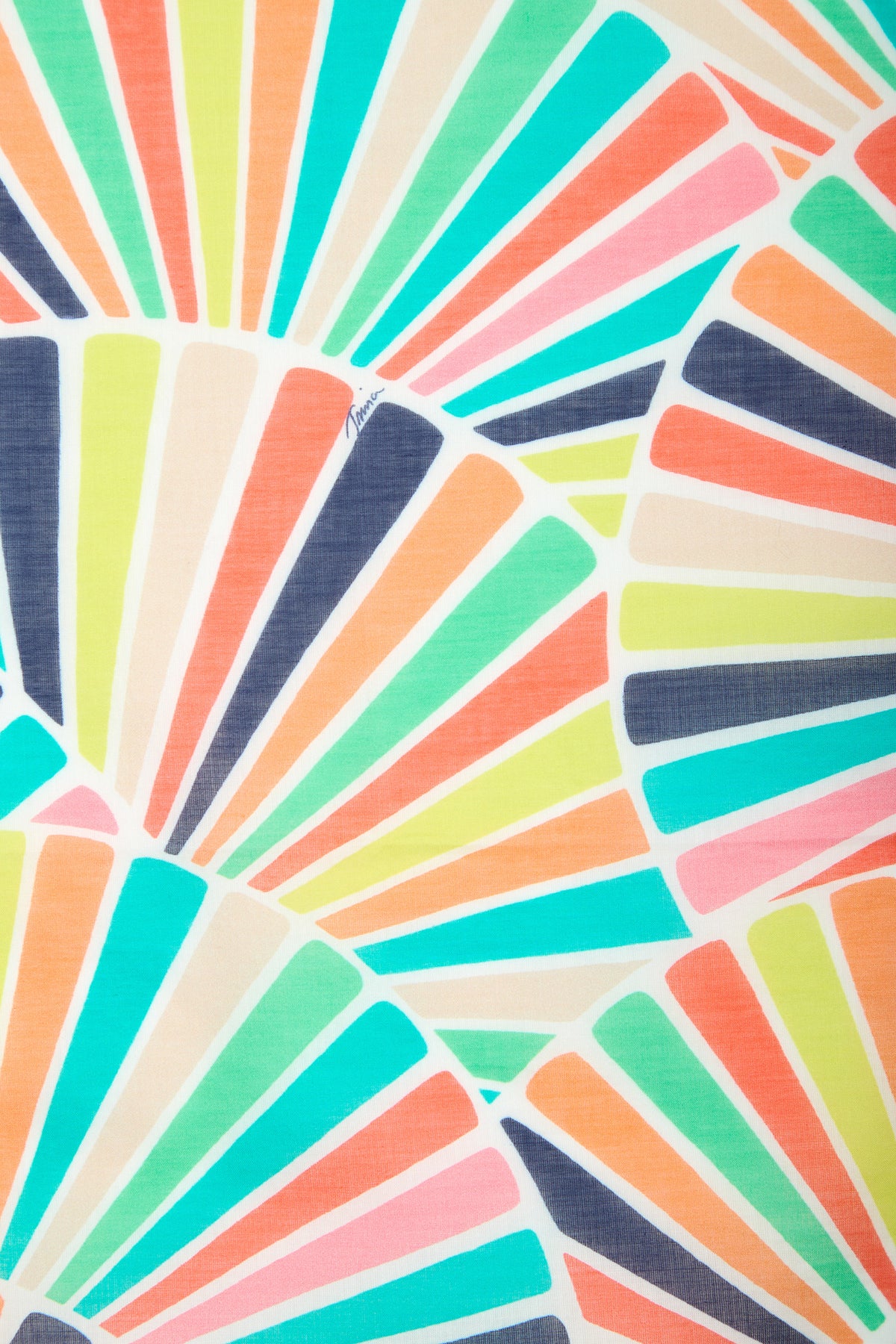 Radiating from multiple points on a white 100% cotton background, the COTTON BANDANA features an abstract pattern of colorful, overlapping rays in turquoise, orange, pink, yellow, navy, and lime that resemble fan shapes or sunbursts.