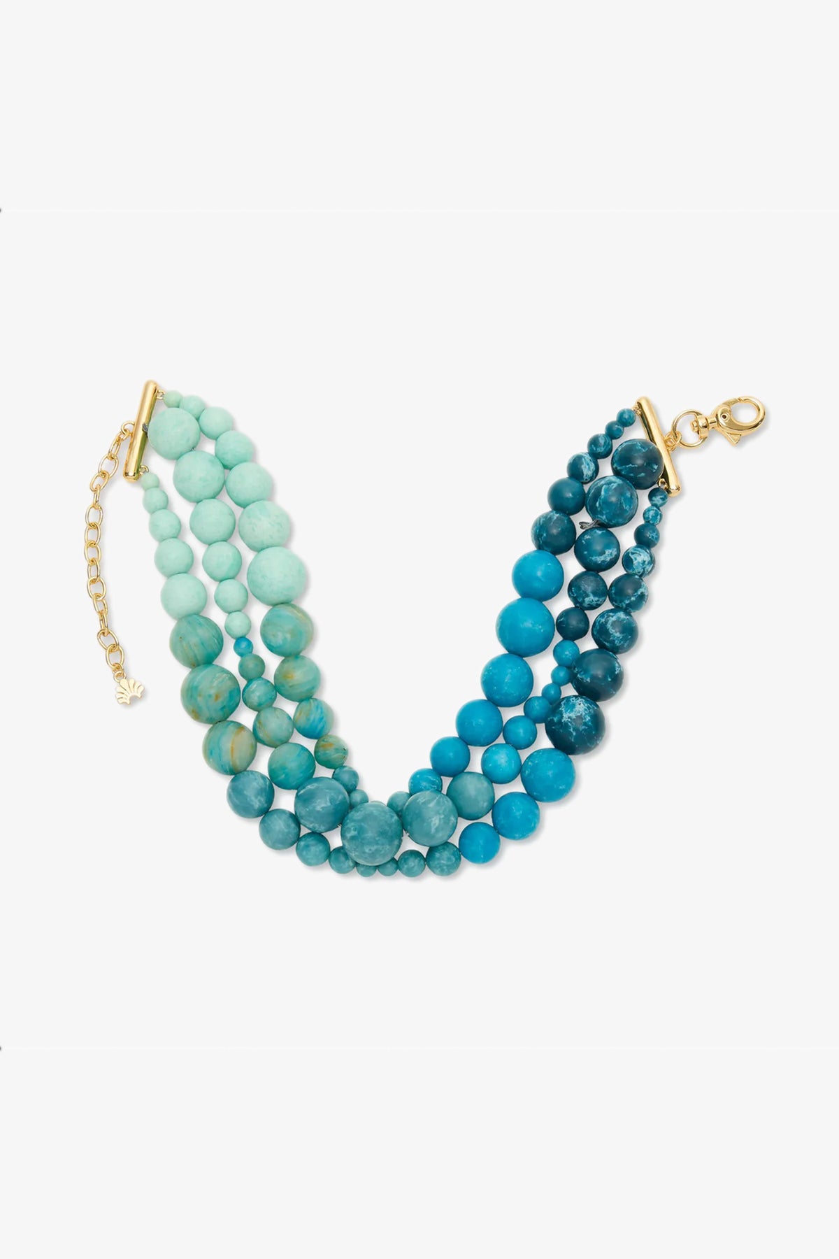 The Riviera Diana Triple Row Necklace features multiple strands of round blue and turquoise beads with a gold clasp and extender chain, displayed on a white background.