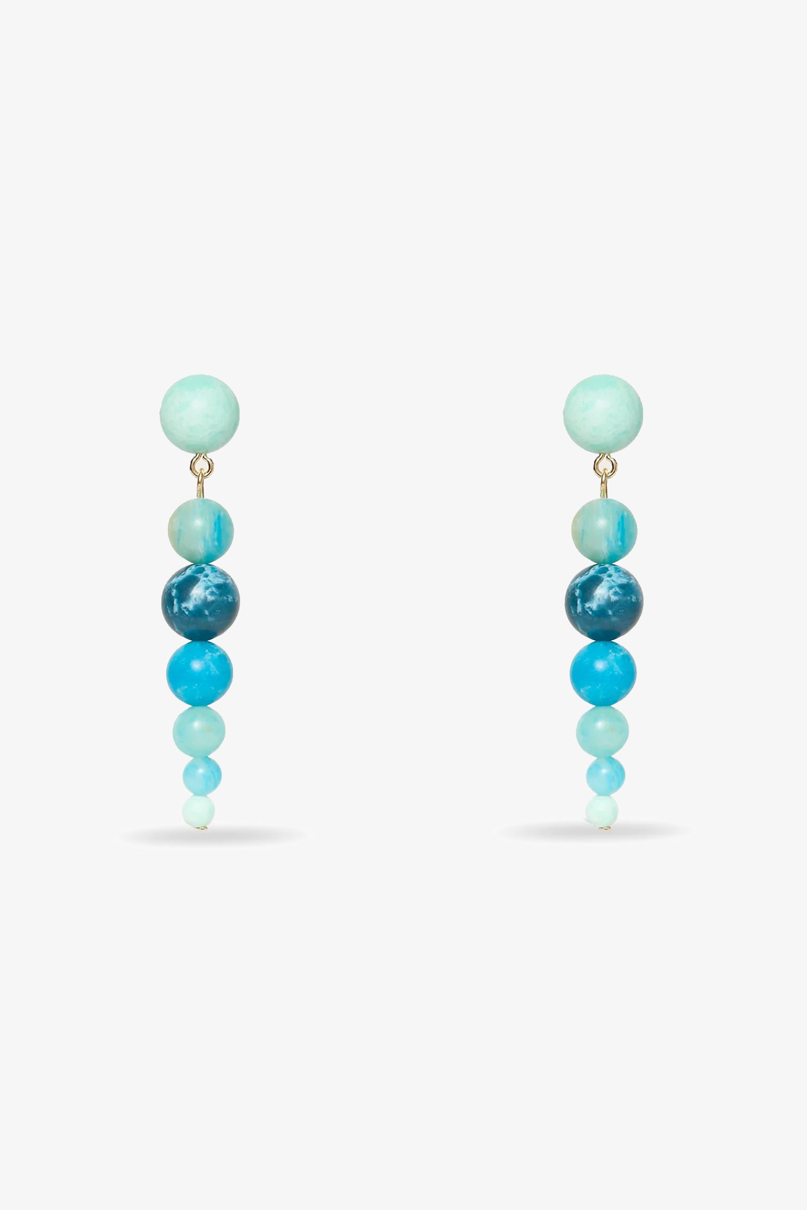 The Riviera Liner Drop Earrings in seafoam feature graduated round beads, arranged from largest at the top to smallest at the bottom, displayed against a plain white background.