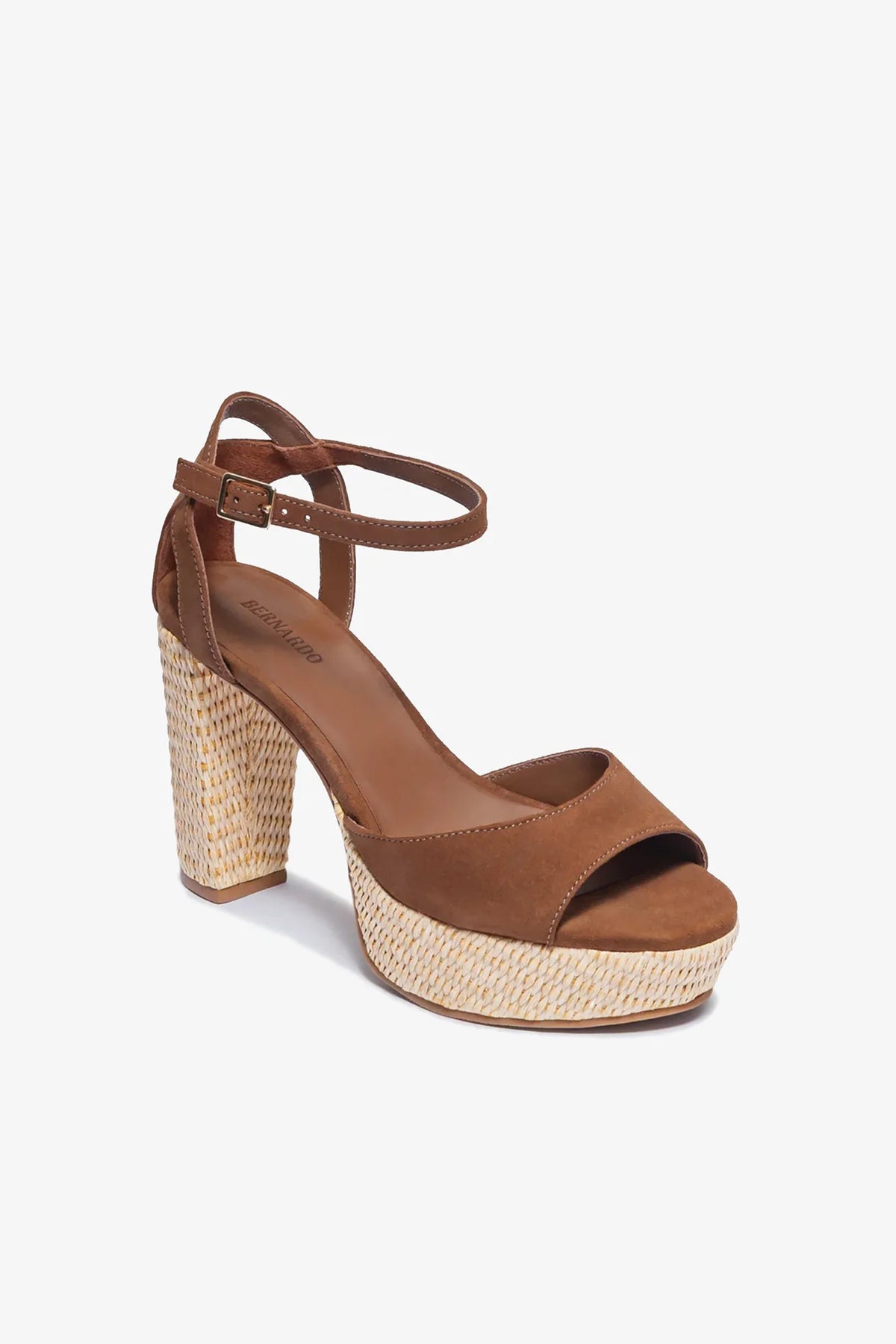 The Valeria Platform Sandal, crafted in brown suede with a chunky woven block heel, open toe, and an ankle strap featuring a buckle, is displayed against a plain white background.