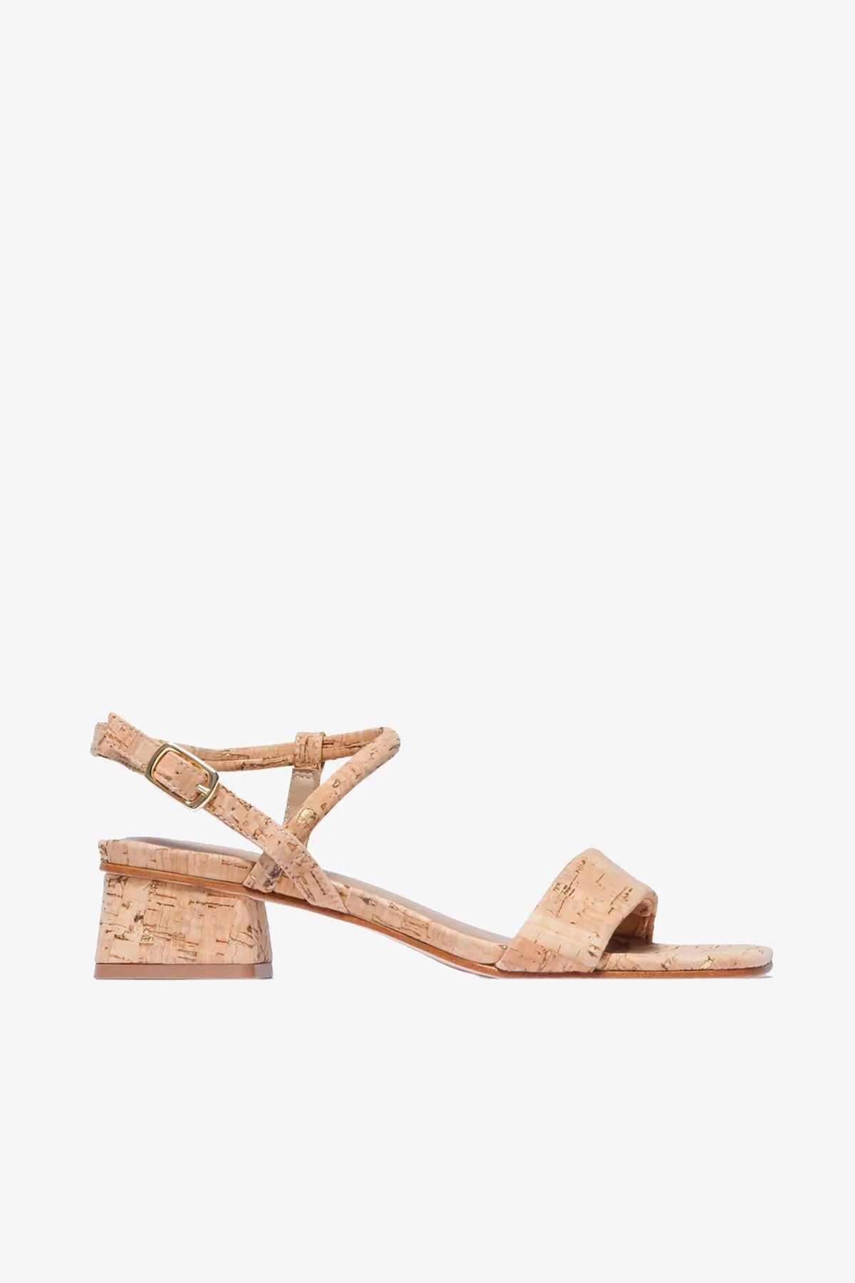 The Josei Low Heel Sandal features a cork construction, low block heel, ankle strap, and small buckle, presented in a side-view against a plain white background.