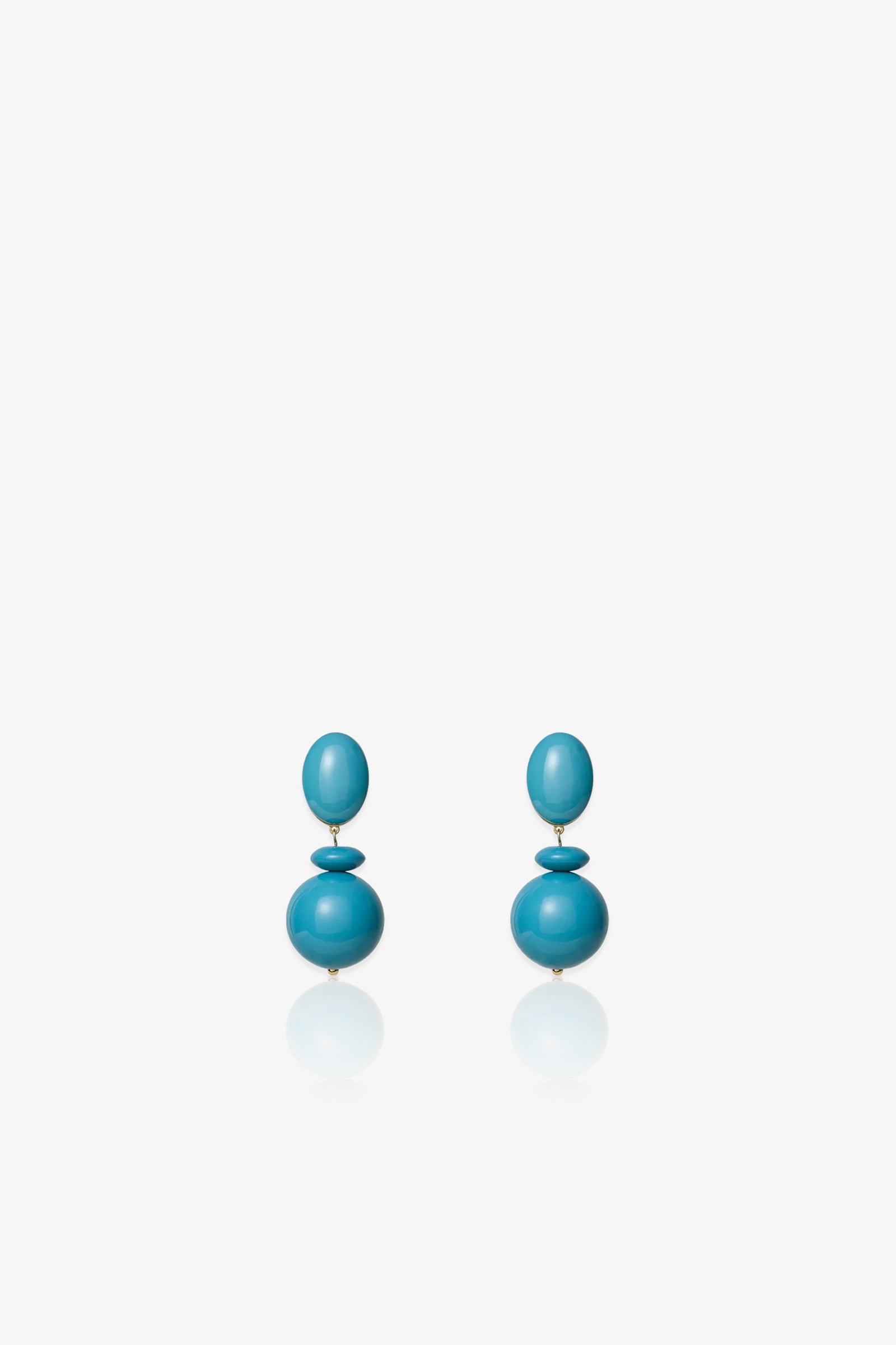 Aventura Drop Earrings in turquoise blue, featuring two stacked round beads on each earring, displayed against a plain white background.