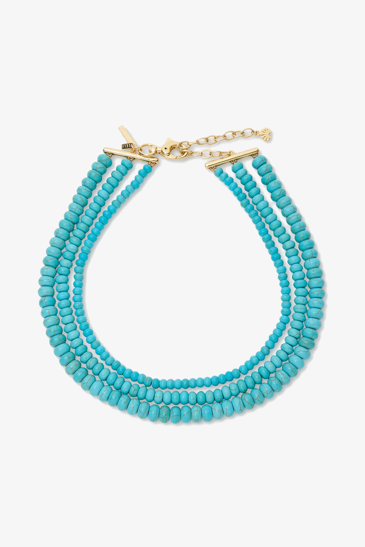 The Turquoise Multi Strand Necklace features three strands of small round turquoise beads with a gold clasp and extender chain, displayed on a white background.