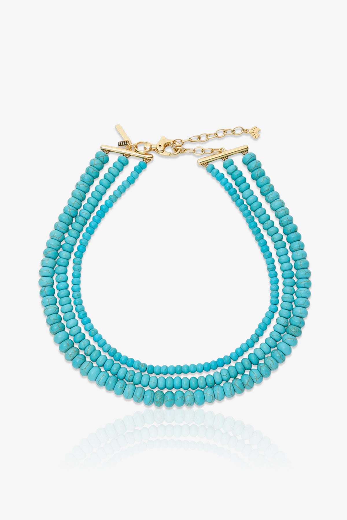 Turquoise Multi Strand Necklace featuring triple strands of turquoise beads, a gold clasp, and an adjustable chain, showcased on a white background.