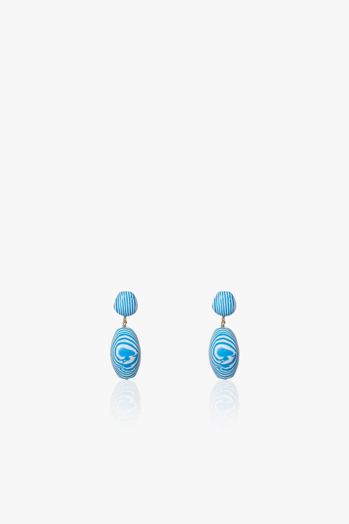 A pair of Ocean Baroque Double Drop Earrings featuring blue and white striped oval studs with larger swirled oval pendants, shown against a plain white background.