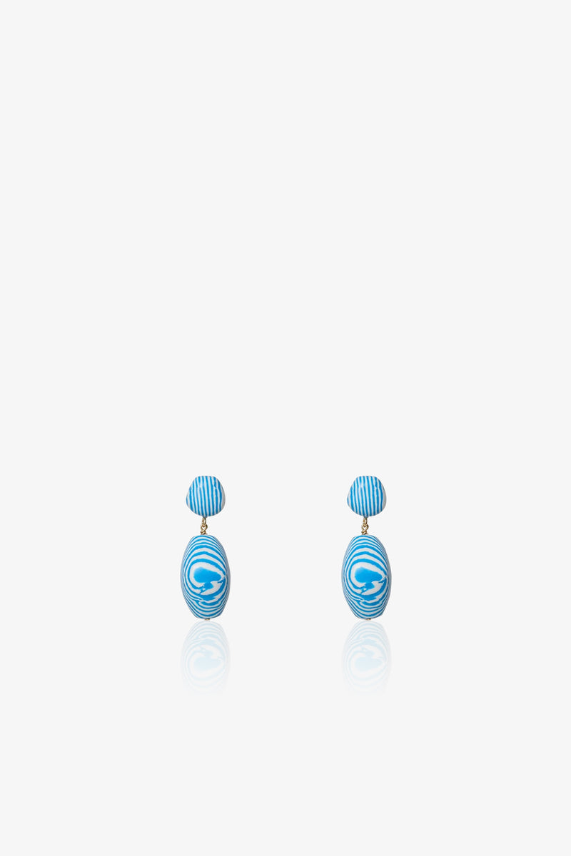 A pair of Ocean Baroque Double Drop Earrings featuring blue and white striped oval studs with larger swirled oval pendants, shown against a plain white background.