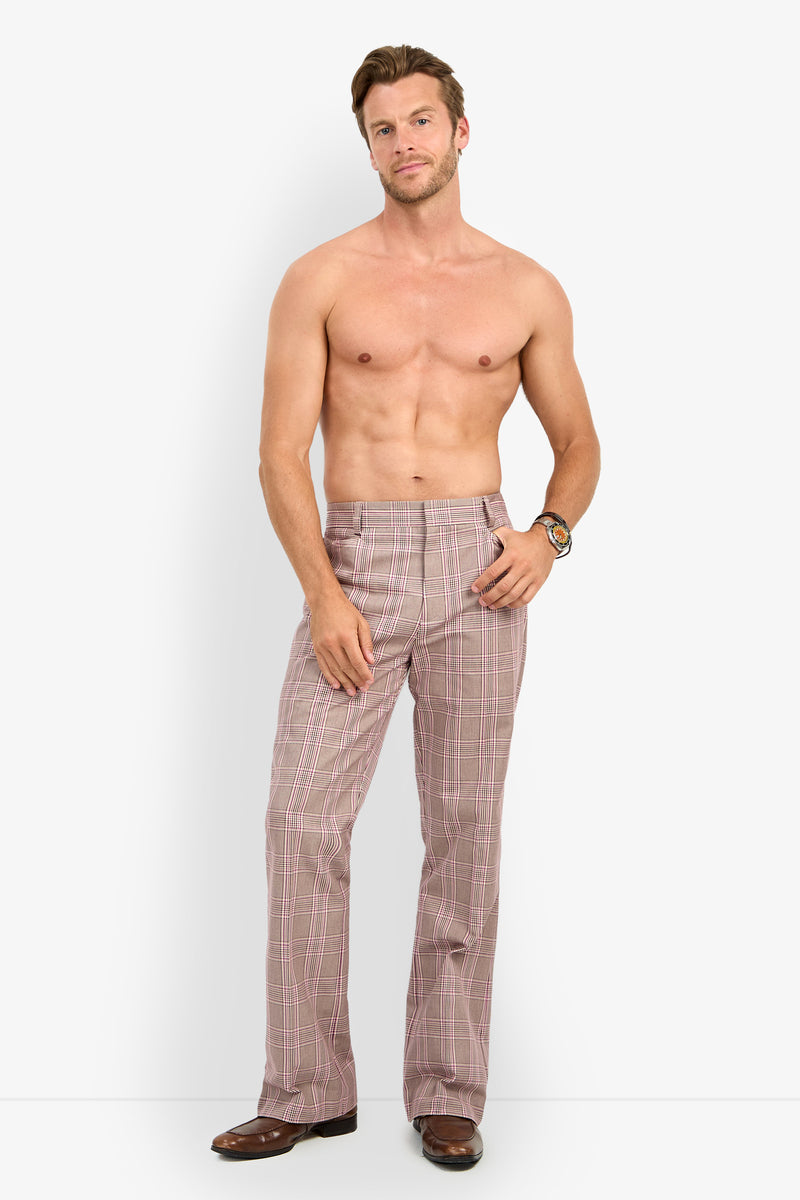 A shirtless man stands facing forward in ALEJANDRO BOOTLEG TROUSER, brown shoes, and a wristwatch against a plain white background.