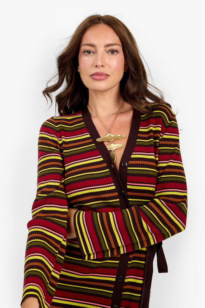 A woman with long brown hair wears the Mercer Sweater Dress, posing against a plain white background.