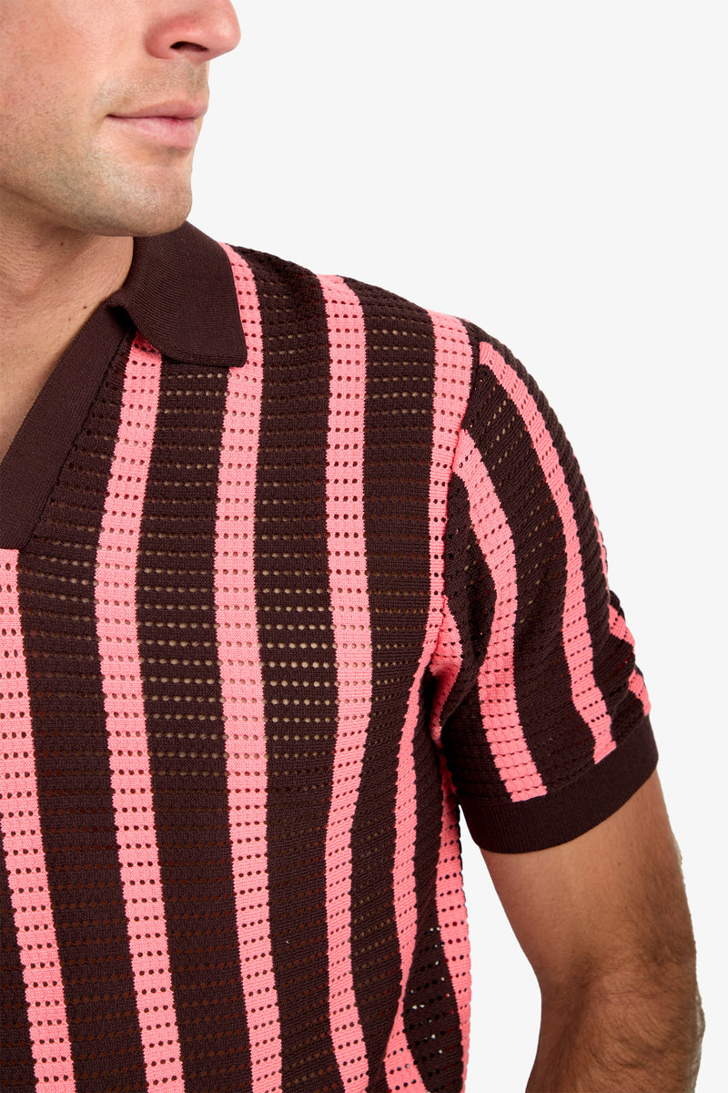A man wearing the Alvin Mesh Polo—a brown and pink striped, short-sleeve knit shirt featuring a textured, perforated pattern. Only his upper torso and part of his face are visible.