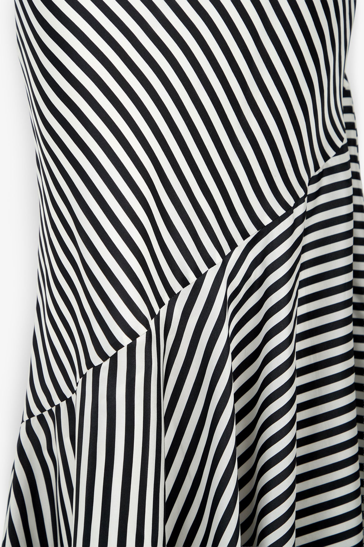 Close-up of the Lady Dress featuring black and white striped fabric, where diagonal, vertical, and horizontal lines intersect to create a bold, geometric pattern.