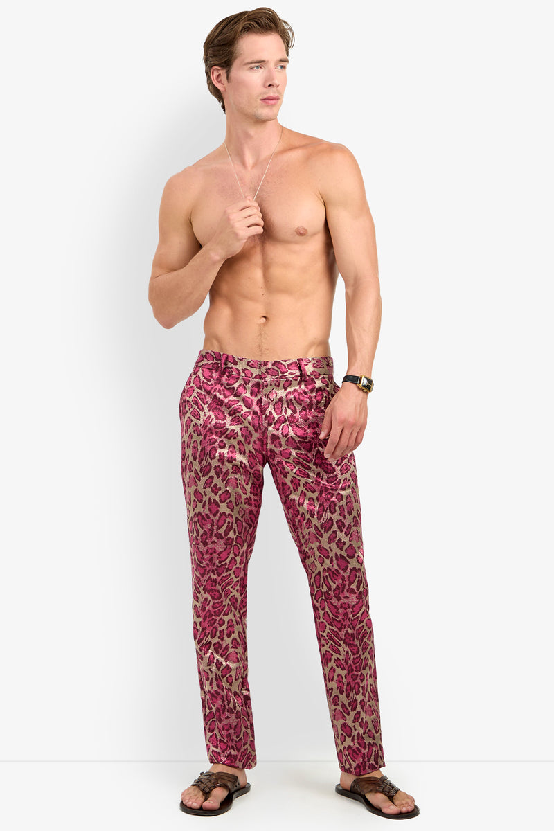 A shirtless man wearing the CLYDE SLIM TROUSER in MULTI, paired with black flip-flops and a wristwatch, standing against a plain white background.