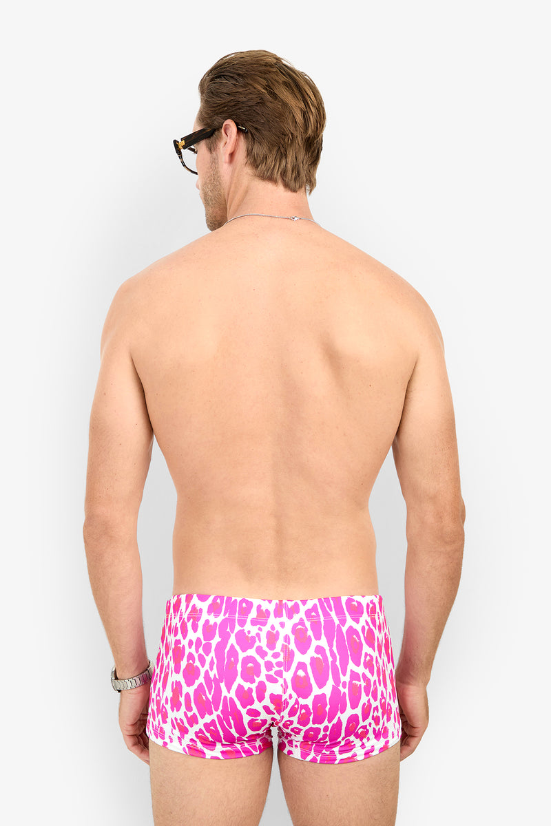 A man seen from behind wearing pink and white leopard-print MONTEGO BAY SWIM TRUNK.