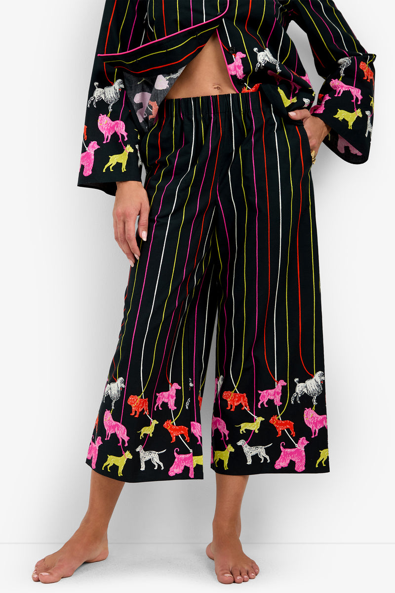RUBEE PANT black 100% cotton cropped pull-on pants with vertical colorful pinstripes and a hemline pattern of various dog breeds on leashes.