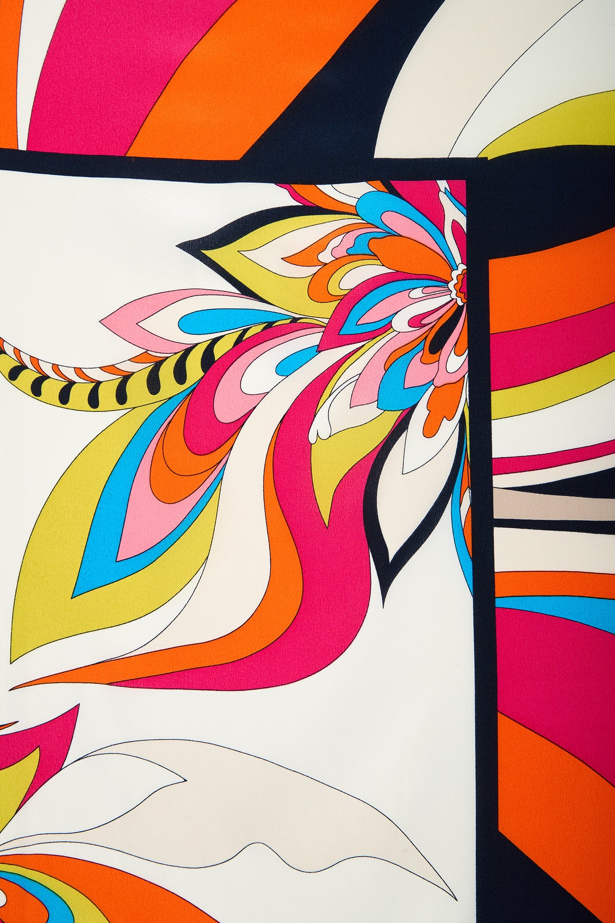 Introducing the Swirl Floral Scarf—a vibrant, dynamic fabric design featuring bold, curved lines and abstract floral patterns in orange, pink, yellow, blue, black, and white.