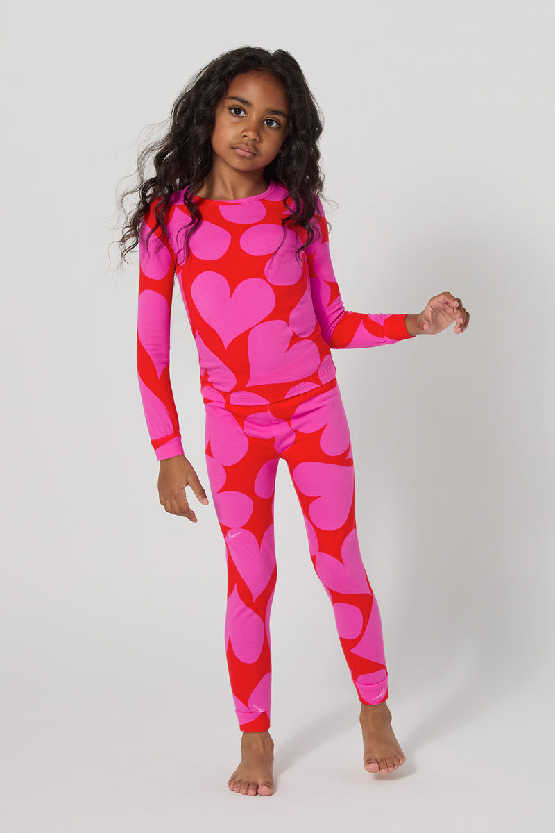 Of course! Please provide the keywords you'd like me to use, and I'll blend them into the description for the HEARTS L/S 2PC KIDS PJ SET.