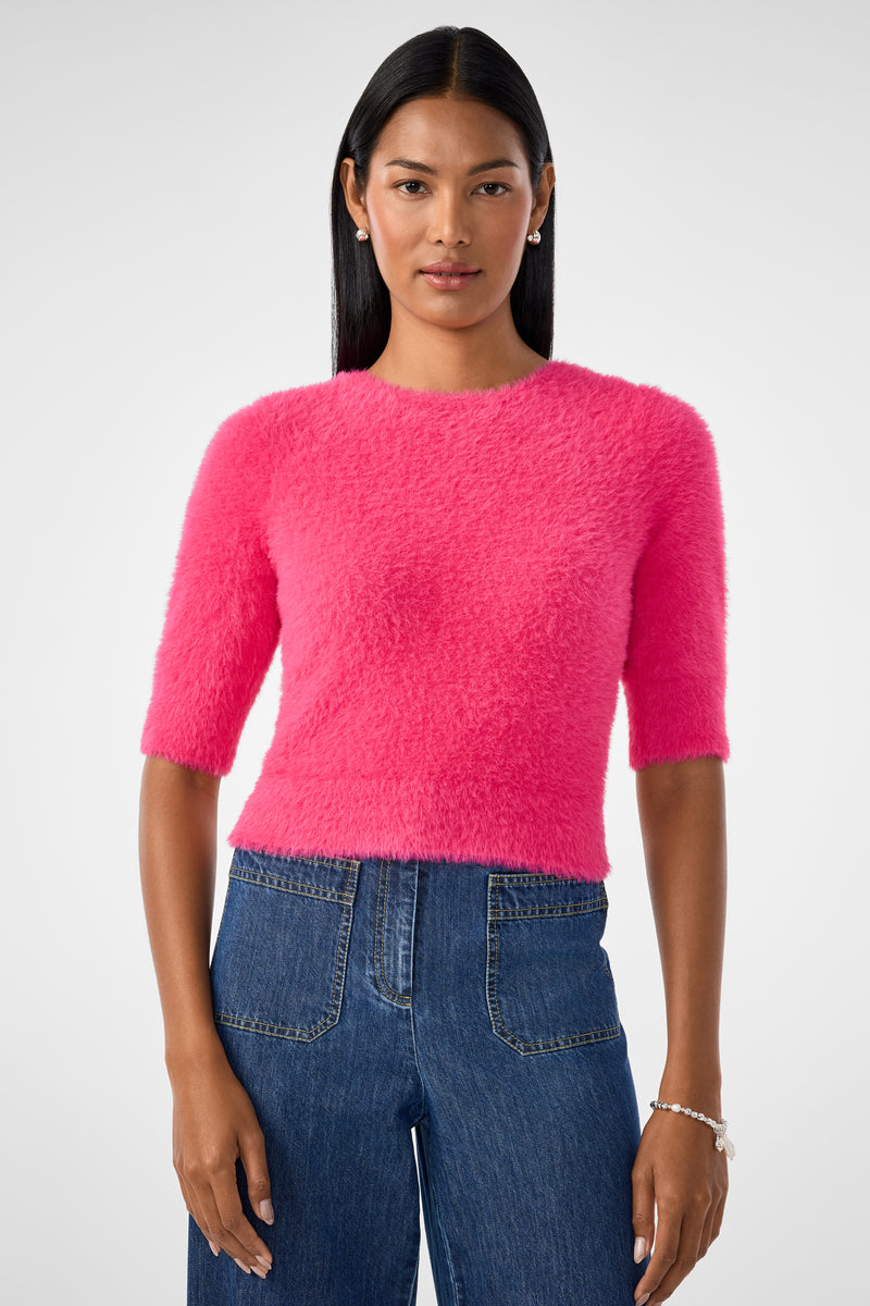 Woman with straight black hair wears the Maliah Fuzzy Sweater in Forrest Rose and blue high-waisted jeans, standing against a plain light gray background.