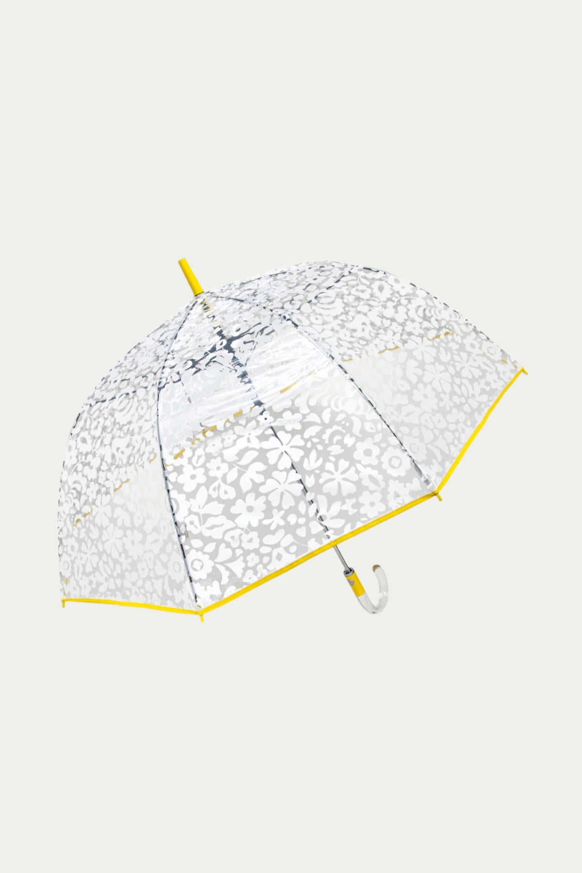 The TT X SR Clear Bubble Umbrella - Poolside features a clear canopy with a white floral pattern, yellow edge trim, and a curved white handle, shown against a plain light background.