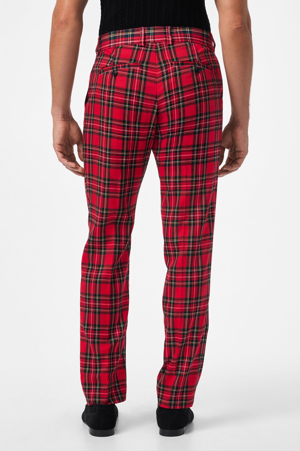 Model faces away, wearing the Clyde Slim Trouser - Can-Can Check, featuring red and black plaid with back pockets and a fitted design. Styled with a black top against a plain white background.