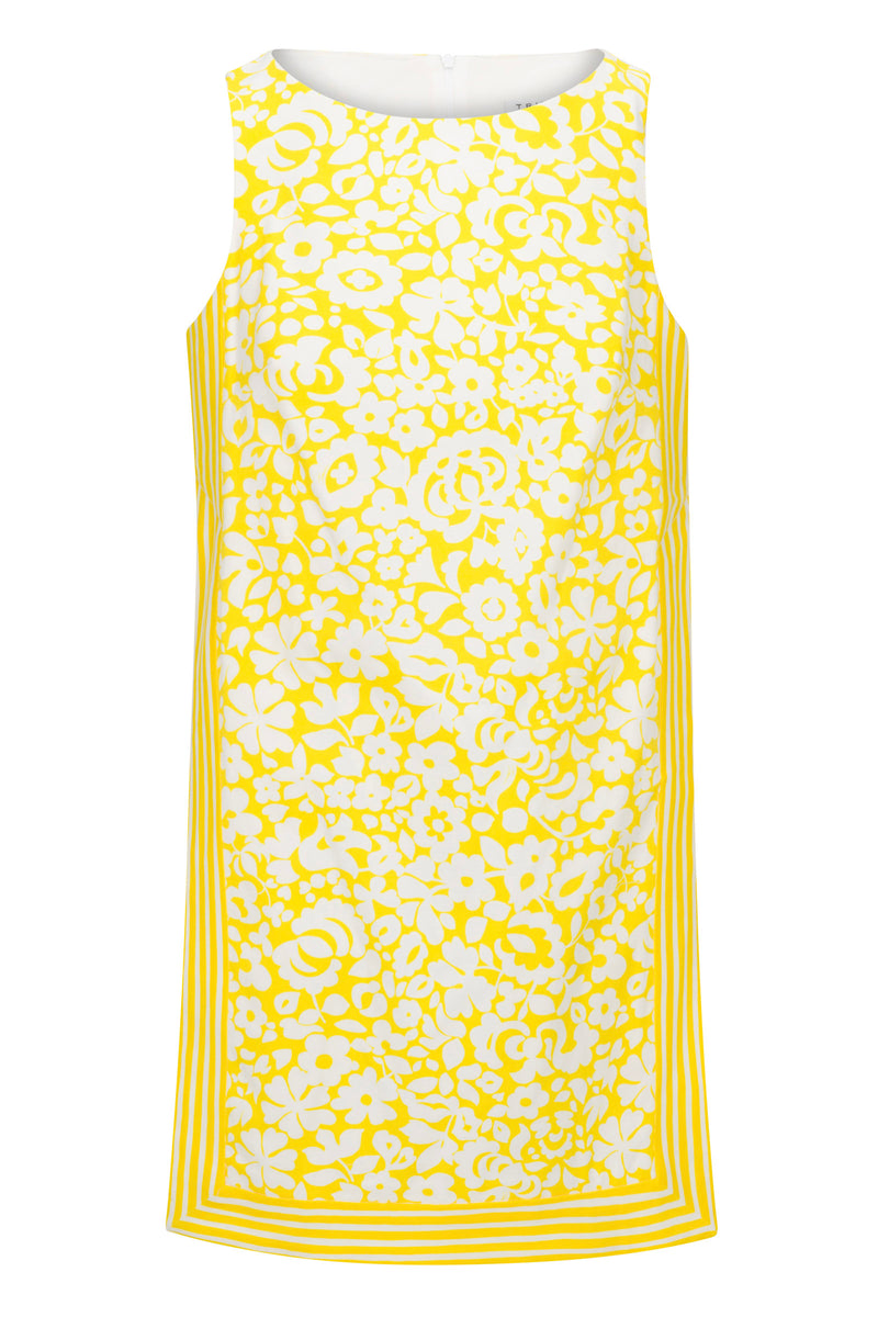 The Brynne 3 Sleeveless Dress - Poolside Gossip features a white base with a yellow floral print and yellow striped borders along the hem and sides.