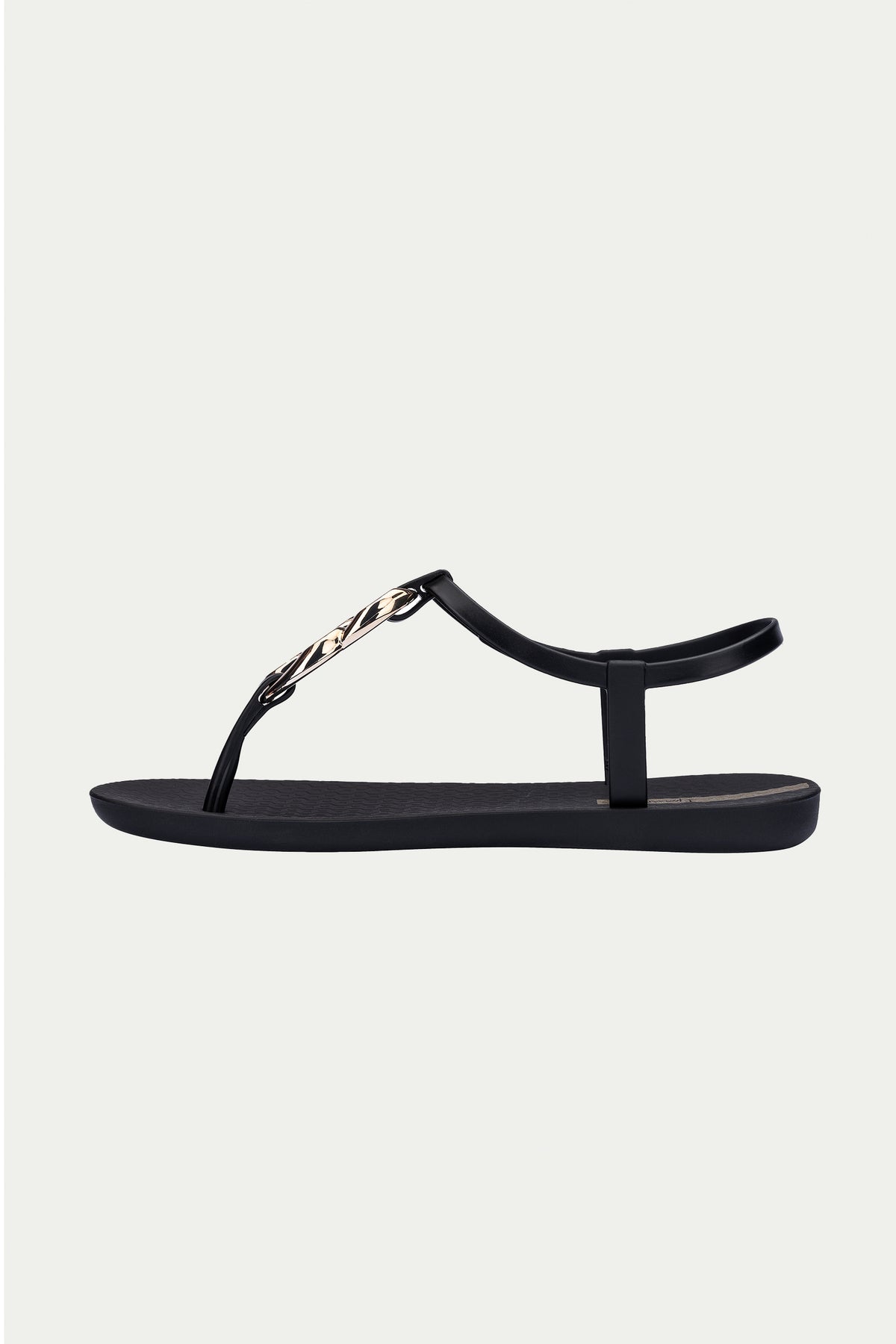 The Ipanema Class Connect Sandal - Black is a flat sandal featuring a thin ankle strap and gold chain detail on the front strap, shown in a side view against a light background.