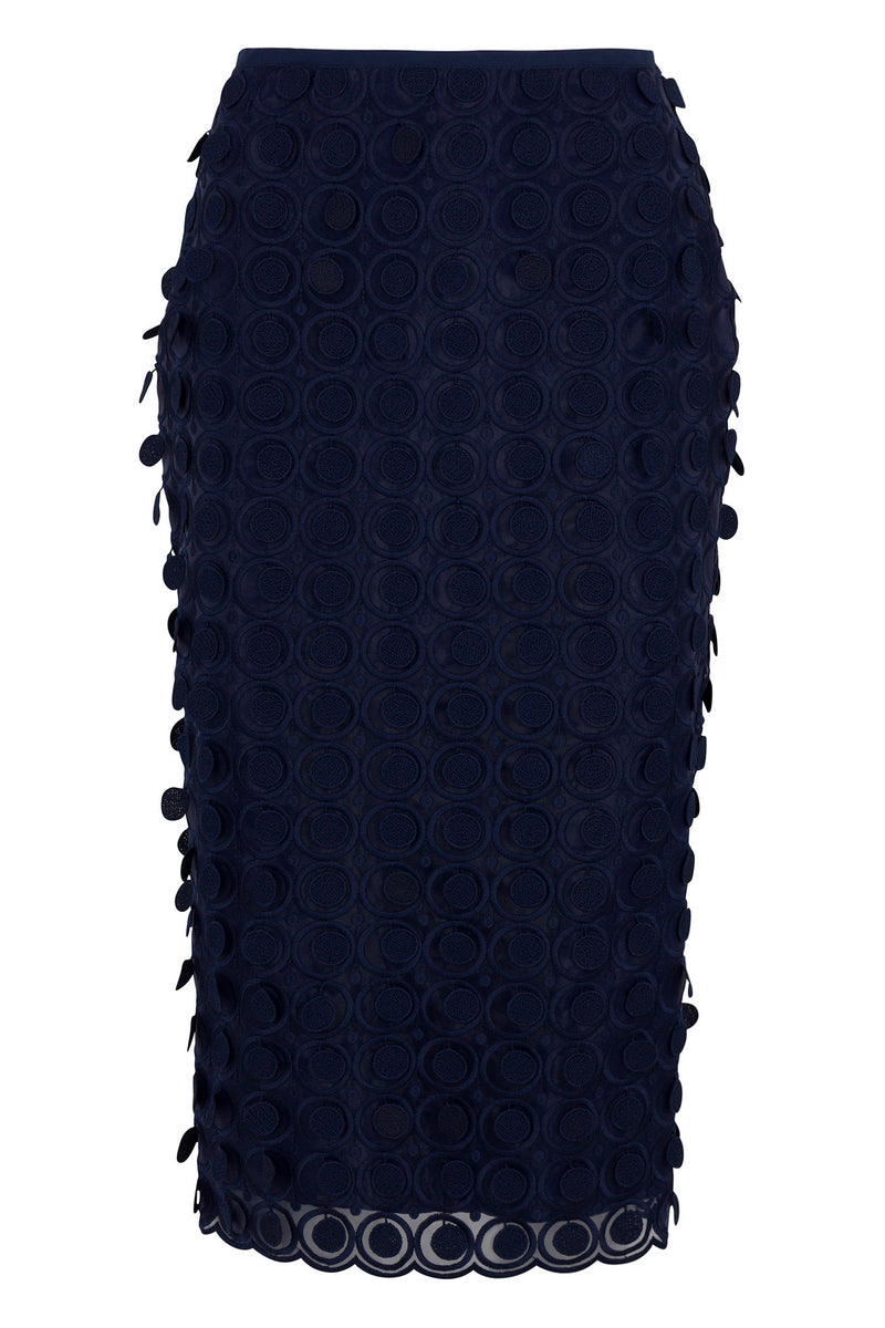 The Dita 2 Midi Pencil Skirt in navy blue features Agassi embroidery with a textured circular pattern, small side appliqués, a scalloped hem, and a fitted silhouette.