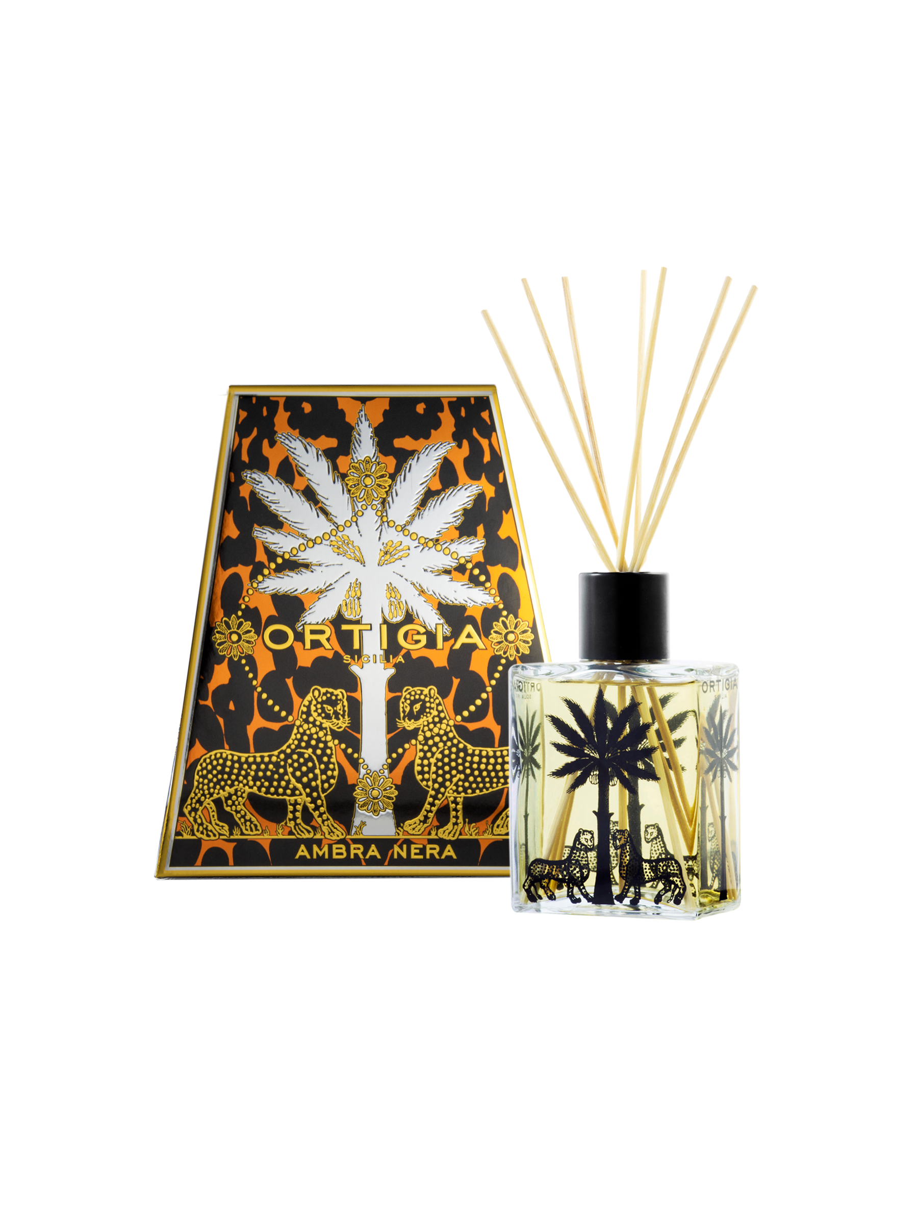 An Ortigia Ambra Nera Diffuser in amber with reed sticks stands beside its ornate box, both adorned with black palm trees and leopards on a gold and black patterned background.