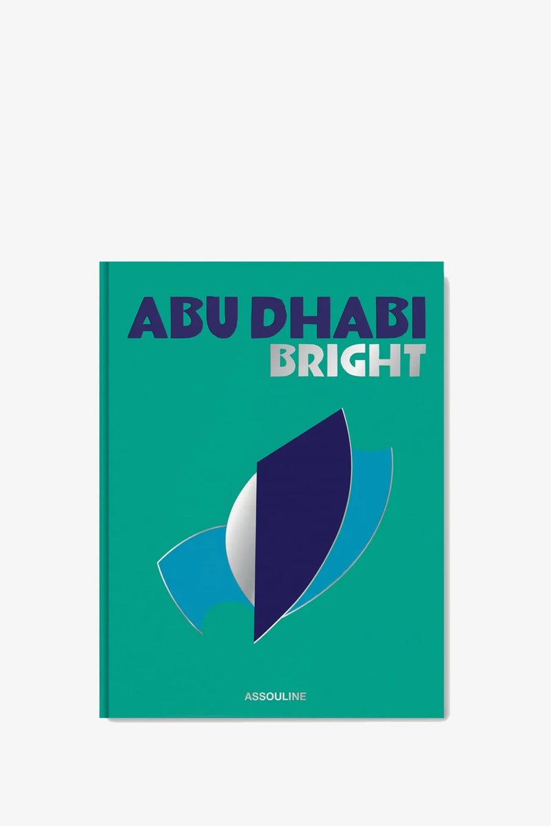 The Assouline Abu Dhabi Book features a teal cover adorned with bold blue and white text, accented by abstract blue and silver shapes, with the publisher “Assouline” printed at the bottom.