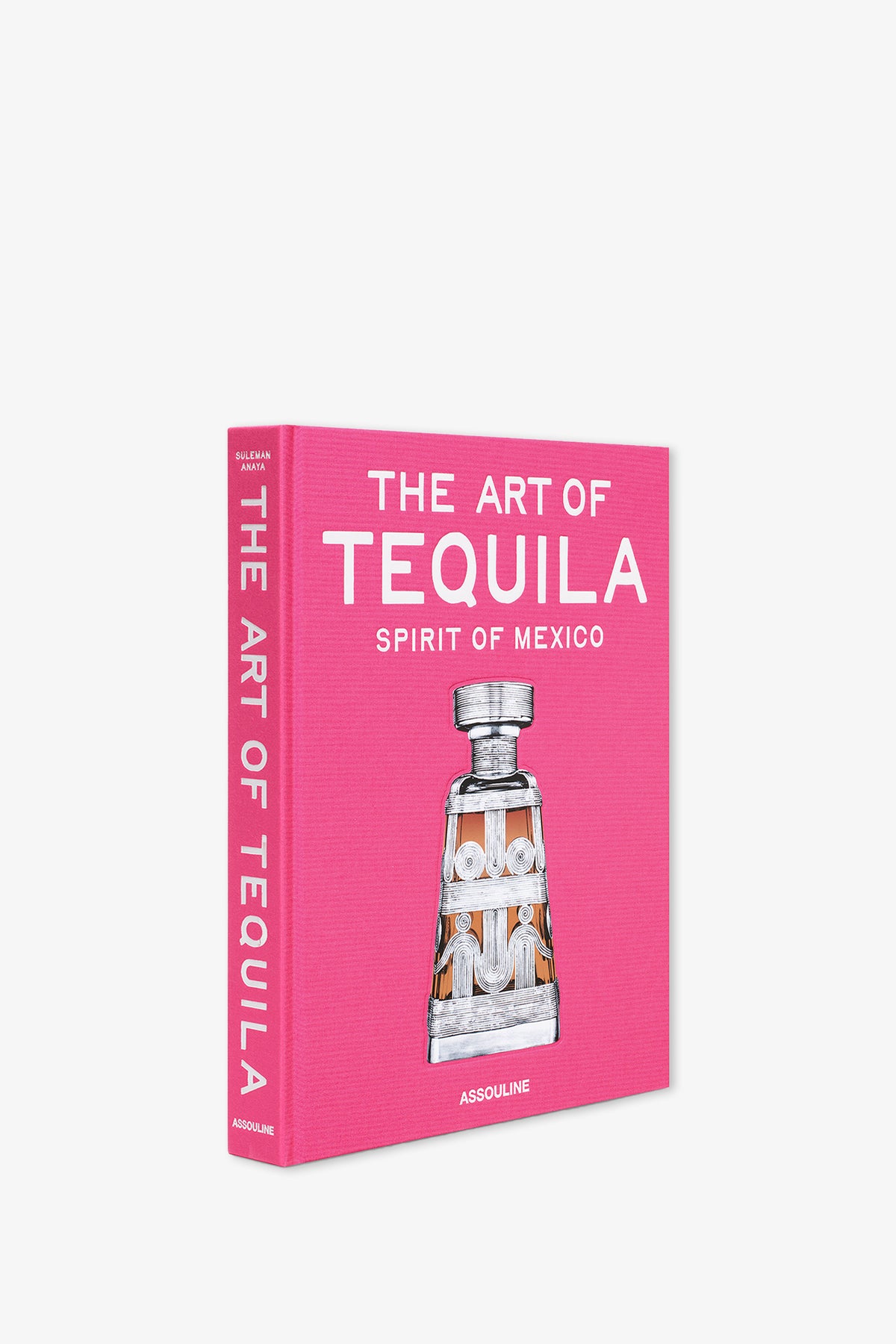 A pink hardcover book titled "Assouline Art Of Tequila Book," featuring an illustration of a tequila bottle on the cover.