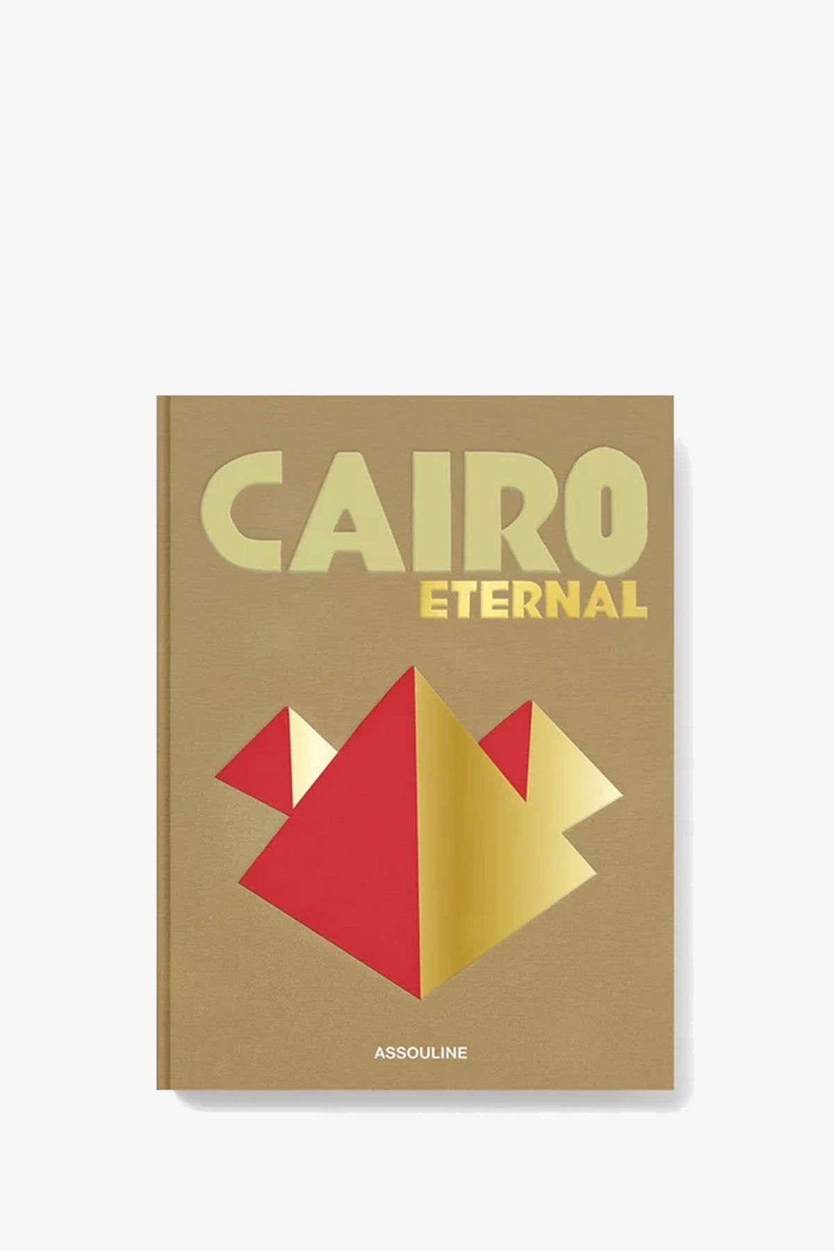 The Assouline Cairo Eternal book features a tan cover with “CAIRO” in pale gold and “ETERNAL” in yellow above a red and gold geometric pyramid design, with the publisher ASSOULINE at the bottom.