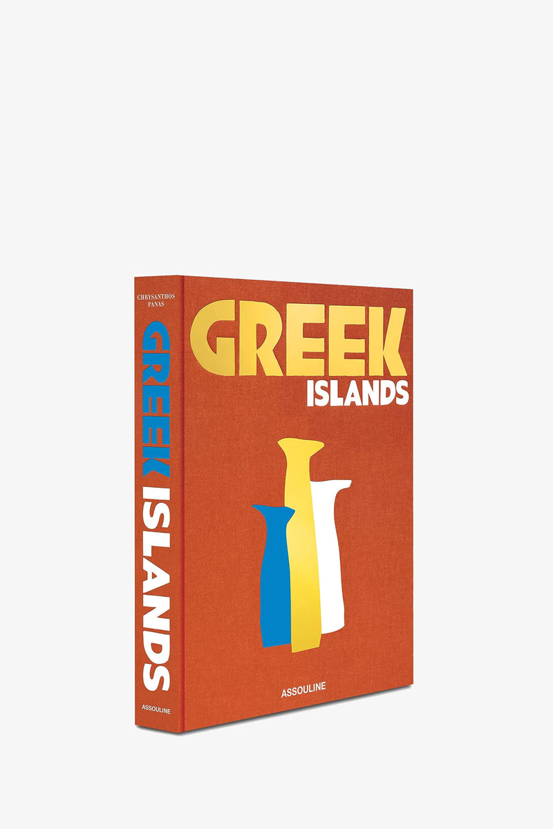 ASSOULINE GREEK ISLANDS is a book with a red cover featuring minimalist illustrations of three vases in blue, white, and yellow, and the title “GREEK ISLANDS” also appears on the spine.