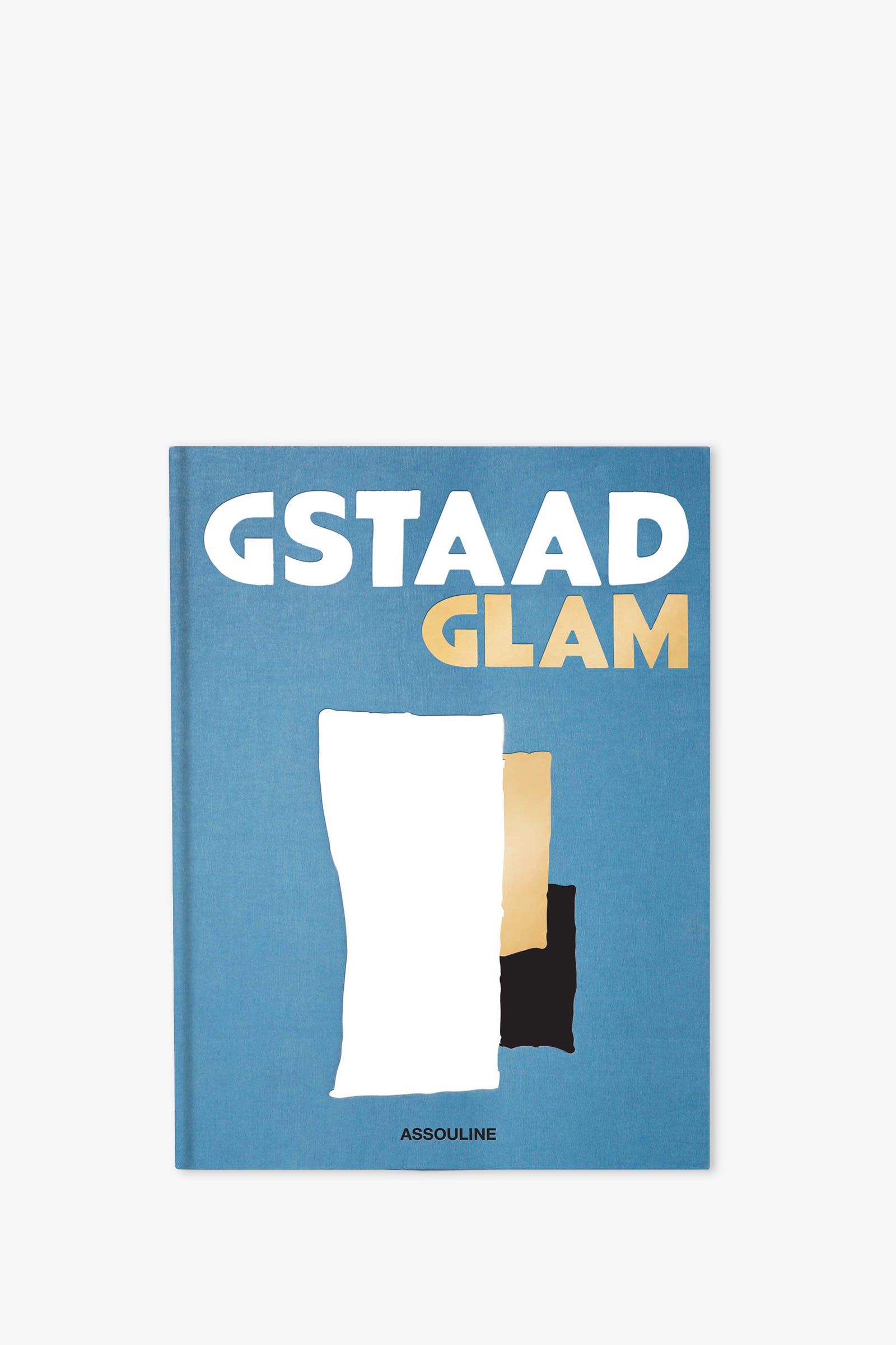 The Assouline Gstaad Glam Book features a blue cover with bold white and gold letters, abstract shapes in white, gold, and black, and the Assouline logo at the bottom.