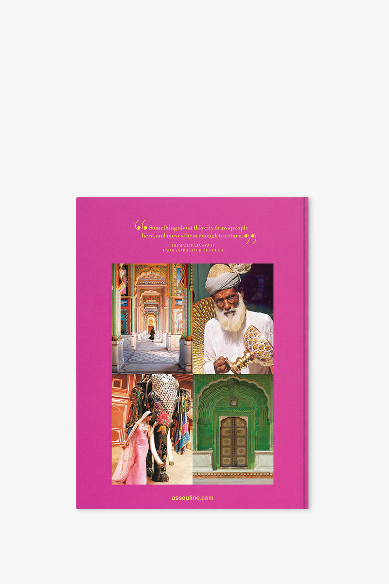 The Assouline Jaipur Splendor Book features a vibrant pink cover adorned with four photos—a colorful hallway, a man in traditional attire, a woman in a sari, and an ornate green doorway—accented by gold text and a quote at the top.