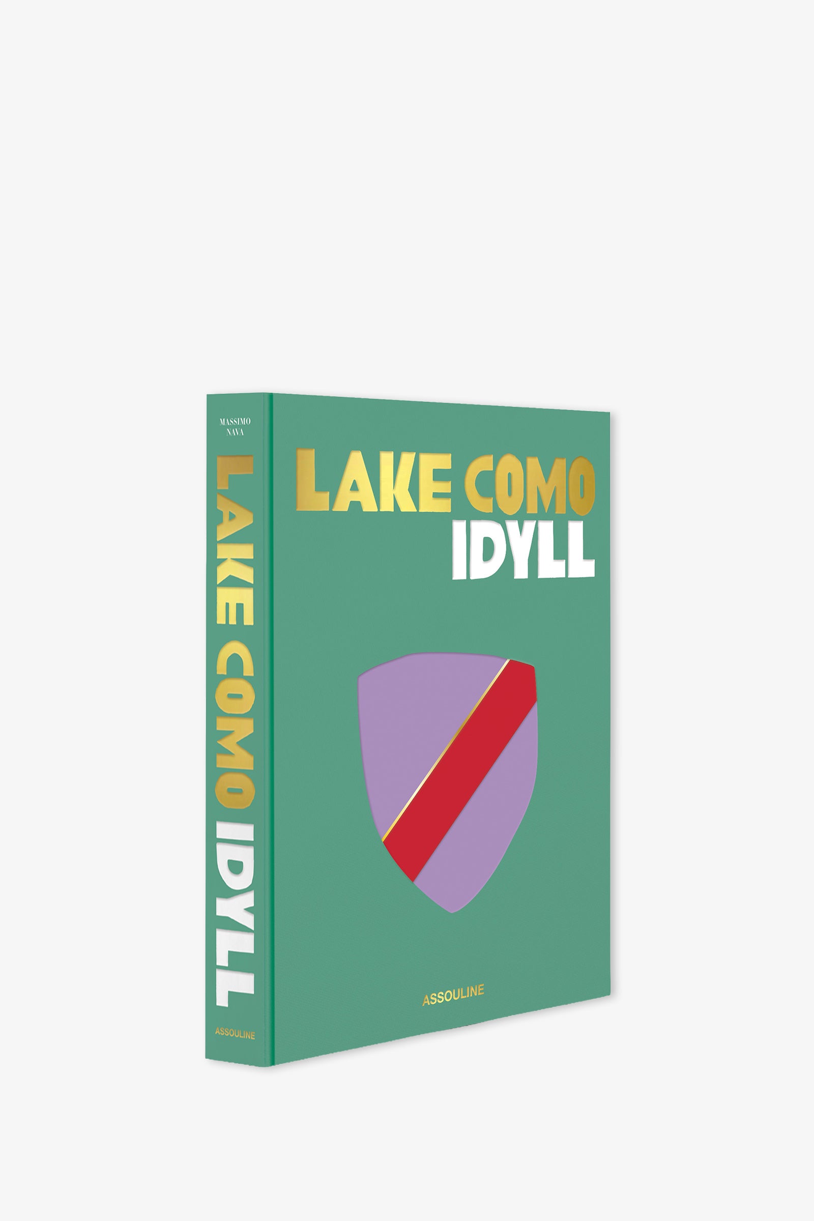 The Assouline Lake Como Idyll Book features a green cover with gold and white text and a stylized shield logo.
