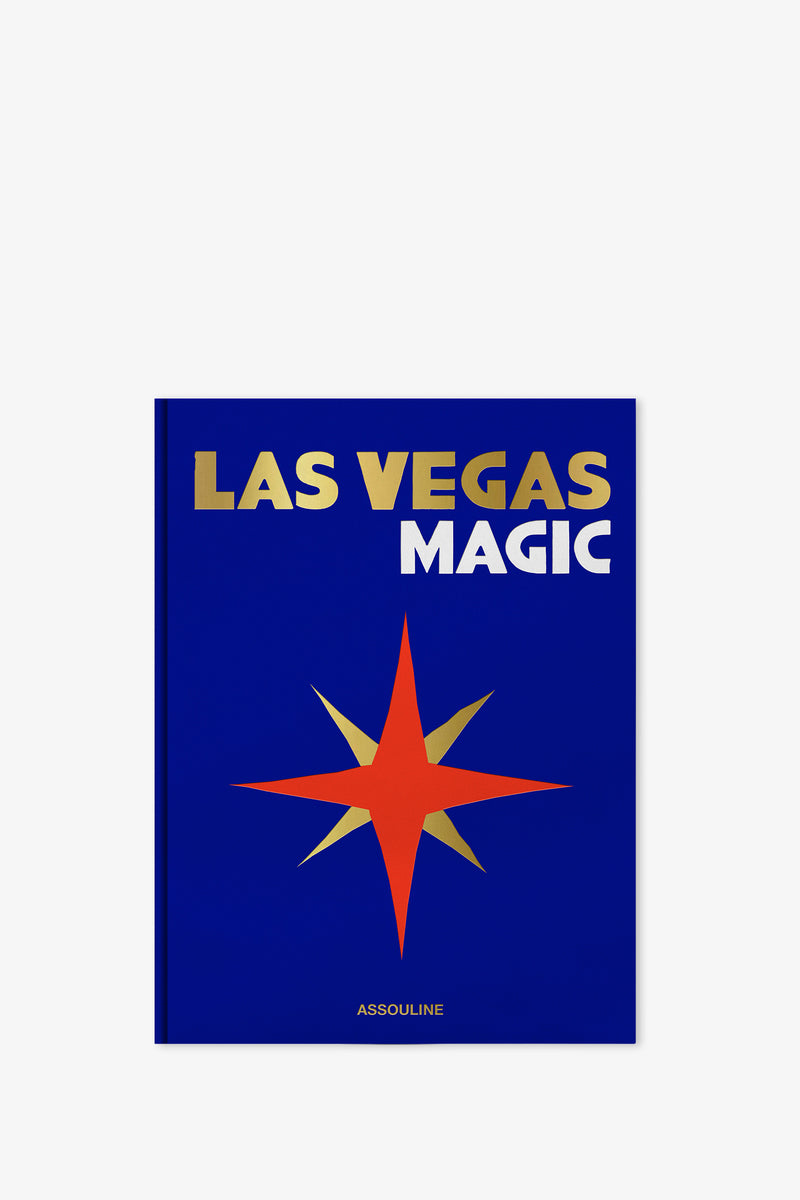 A blue cover edition of the Assouline Las Vegas Magic Book, featuring the title in gold and white text along with a red and orange eight-pointed star adorned with gold accents. The publisher's name, Assouline, is displayed at the bottom in white.