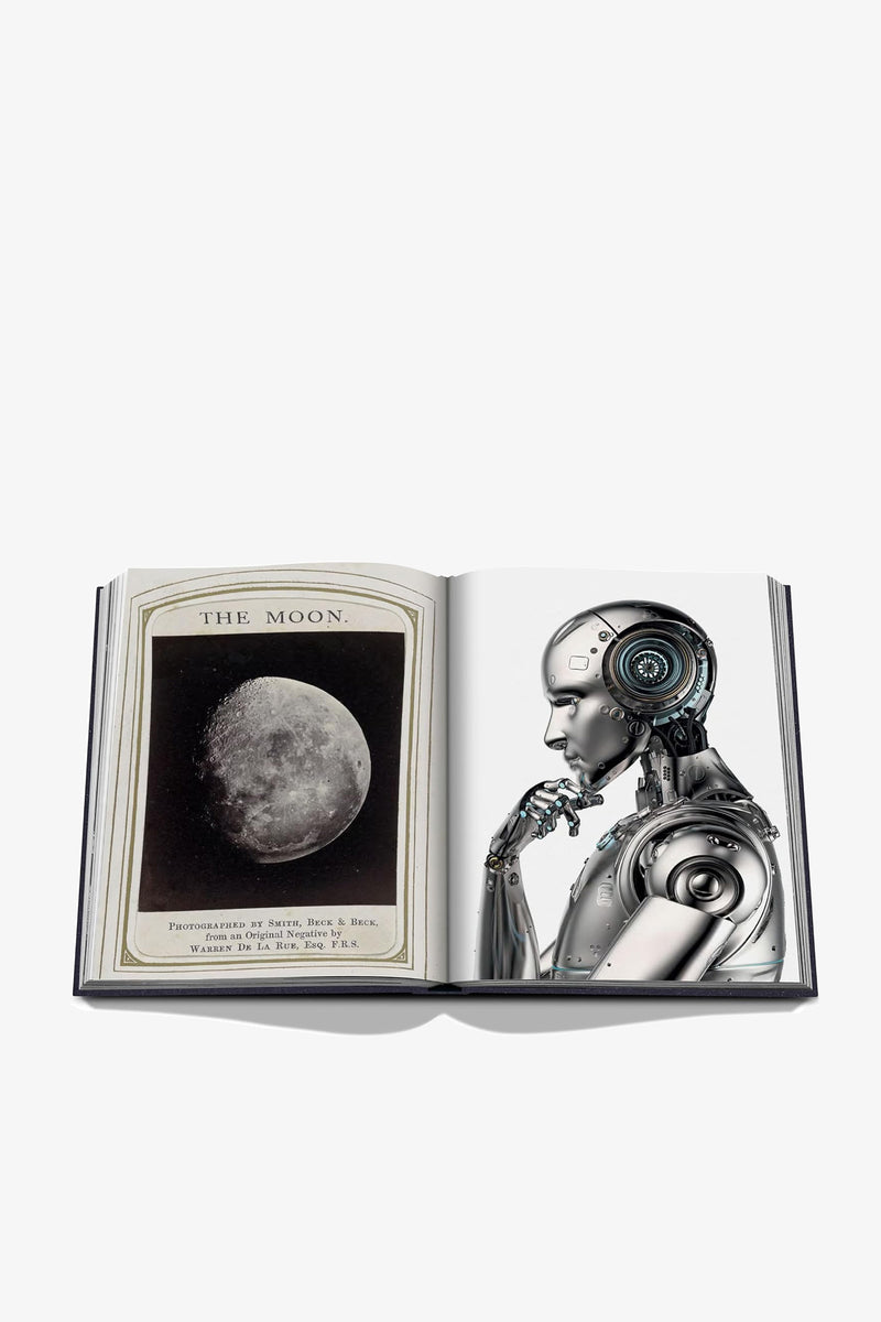 An open Assouline Moon Paradise Book displays a vintage photo of the moon on one page and a reflective robot in a thinking pose on the other.