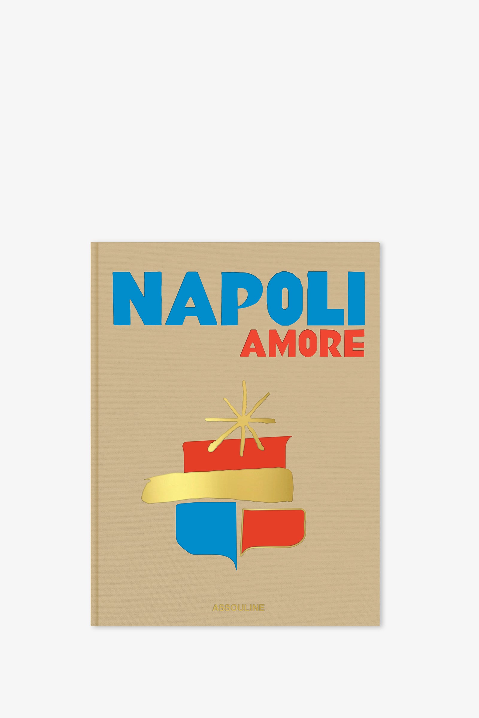 The Assouline Napoli Amore Book features a beige cover with the title “NAPOLI AMORE” in bold blue and red lettering, a stylized gold, red, and blue crest underneath, and the publisher’s name “ASSOULINE” at the bottom.