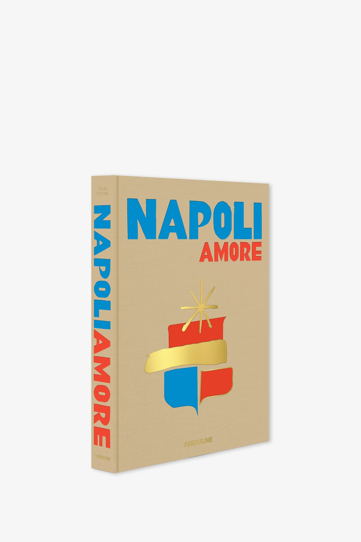 A beige Assouline Napoli Amore Book with blue and red text, featuring a gold and red emblem on the cover. The spine also displays the title vertically.