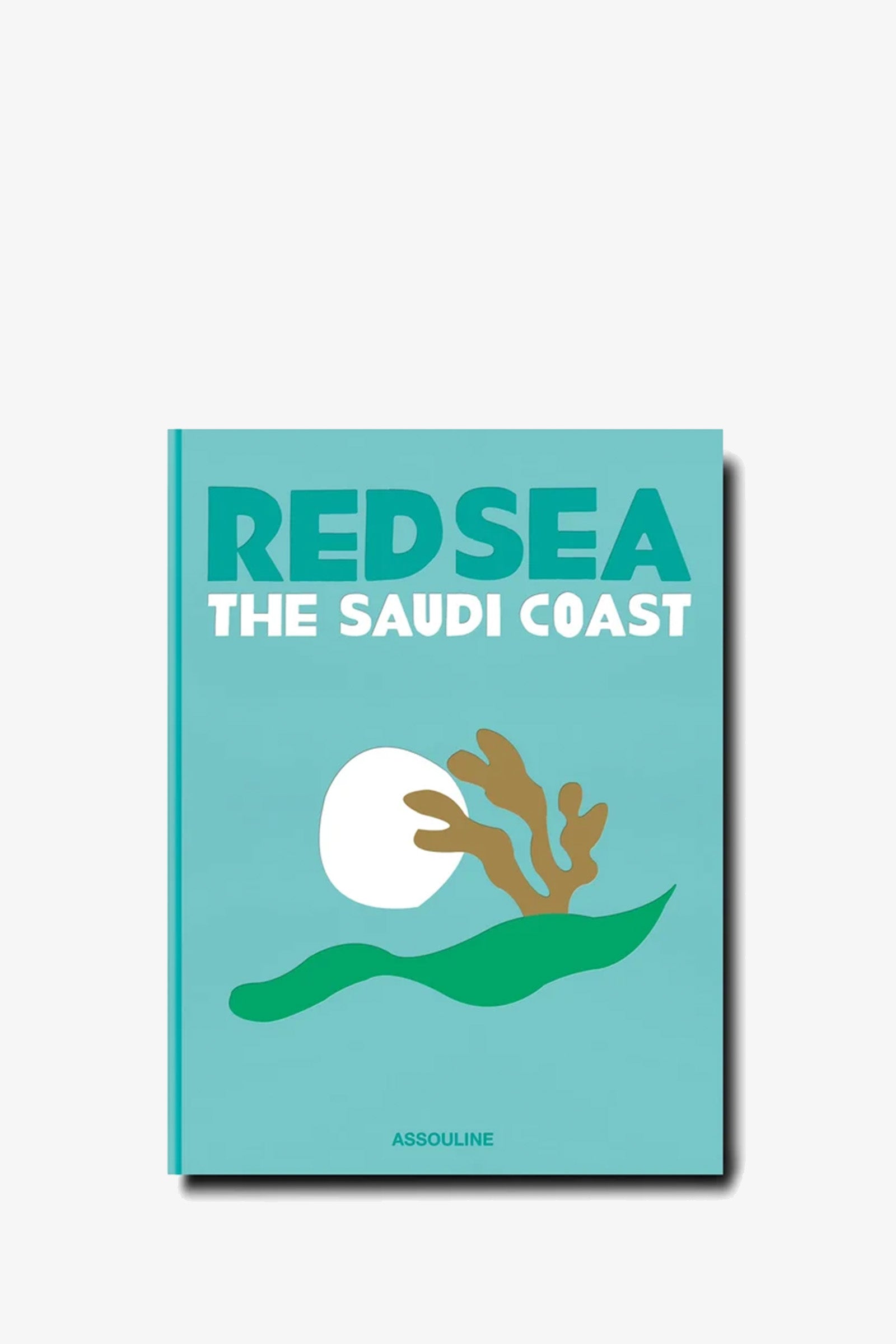 A turquoise cover of the Assouline Saudi Arabia: Red Sea Book features stylized waves, a white sun, and coral, with ASSOULINE printed at the bottom.