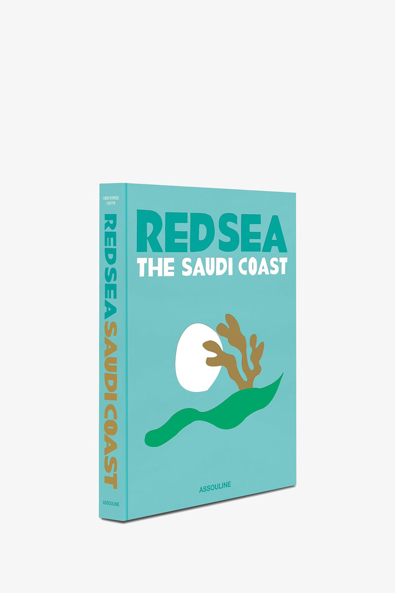A turquoise Assouline Saudi Arabia: Red Sea Book featuring an illustration of a white sun, coral, and green waves on the cover; both the spine and front display the title and publisher, Assouline.