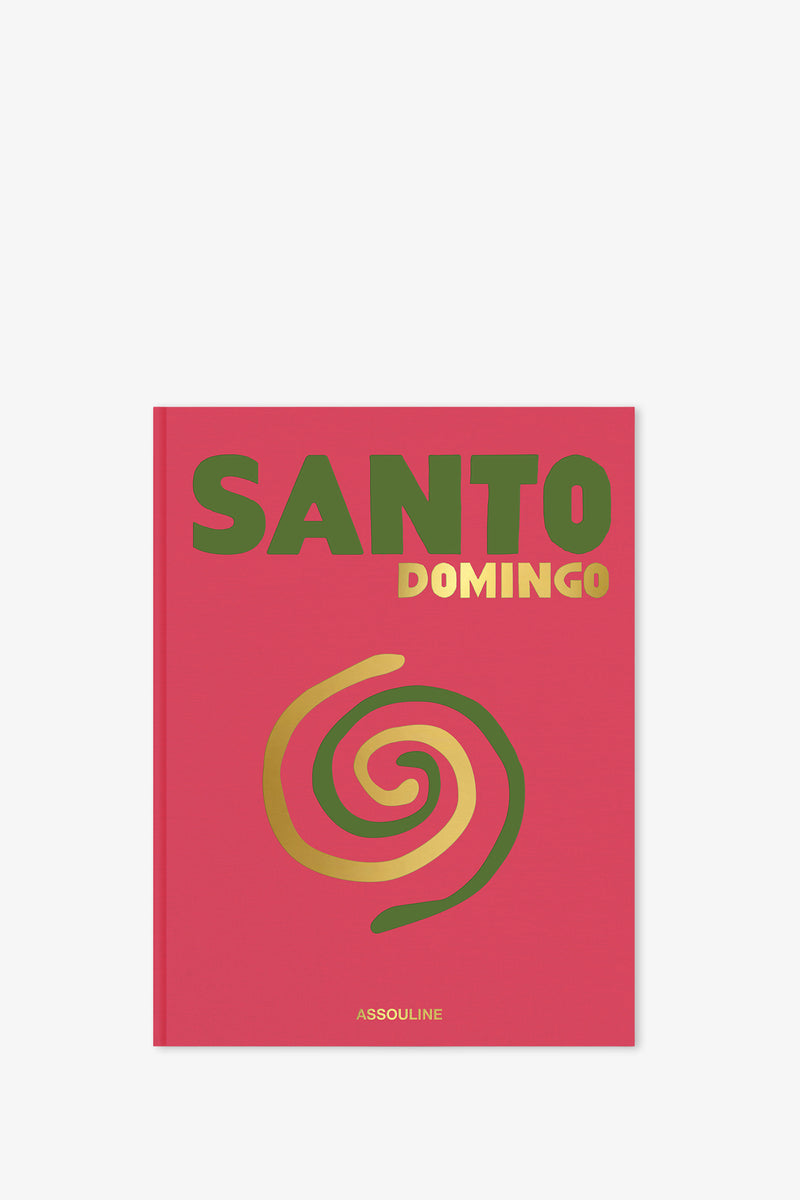 Assouline Santo Domingo Book features a bold red cover with "SANTO" in large green letters, "DOMINGO" in smaller gold lettering, a striking gold and red spiral design beneath them, and the Assouline logo at the bottom.