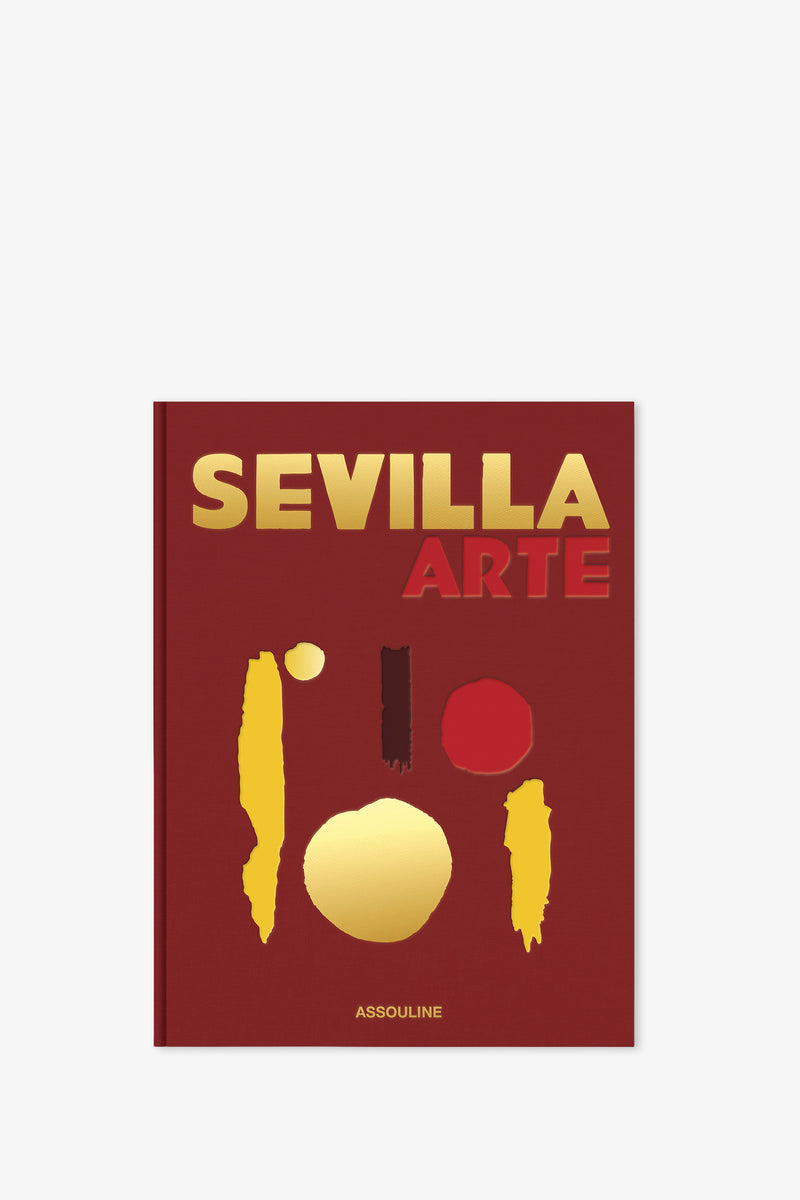 The Assouline Sevilla Arte Book features a striking red cover adorned with gold and red abstract shapes and bold gold and red lettering, with the publisher's name, Assouline, displayed at the bottom in smaller gold text.