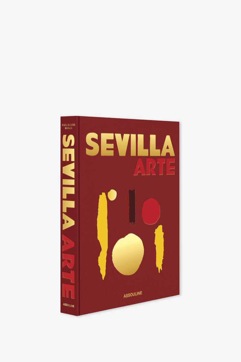 The Assouline Sevilla Arte Book is a red hardcover featuring bold yellow and red text and abstract shapes on the cover, with the title displayed vertically in yellow and red along the spine.
