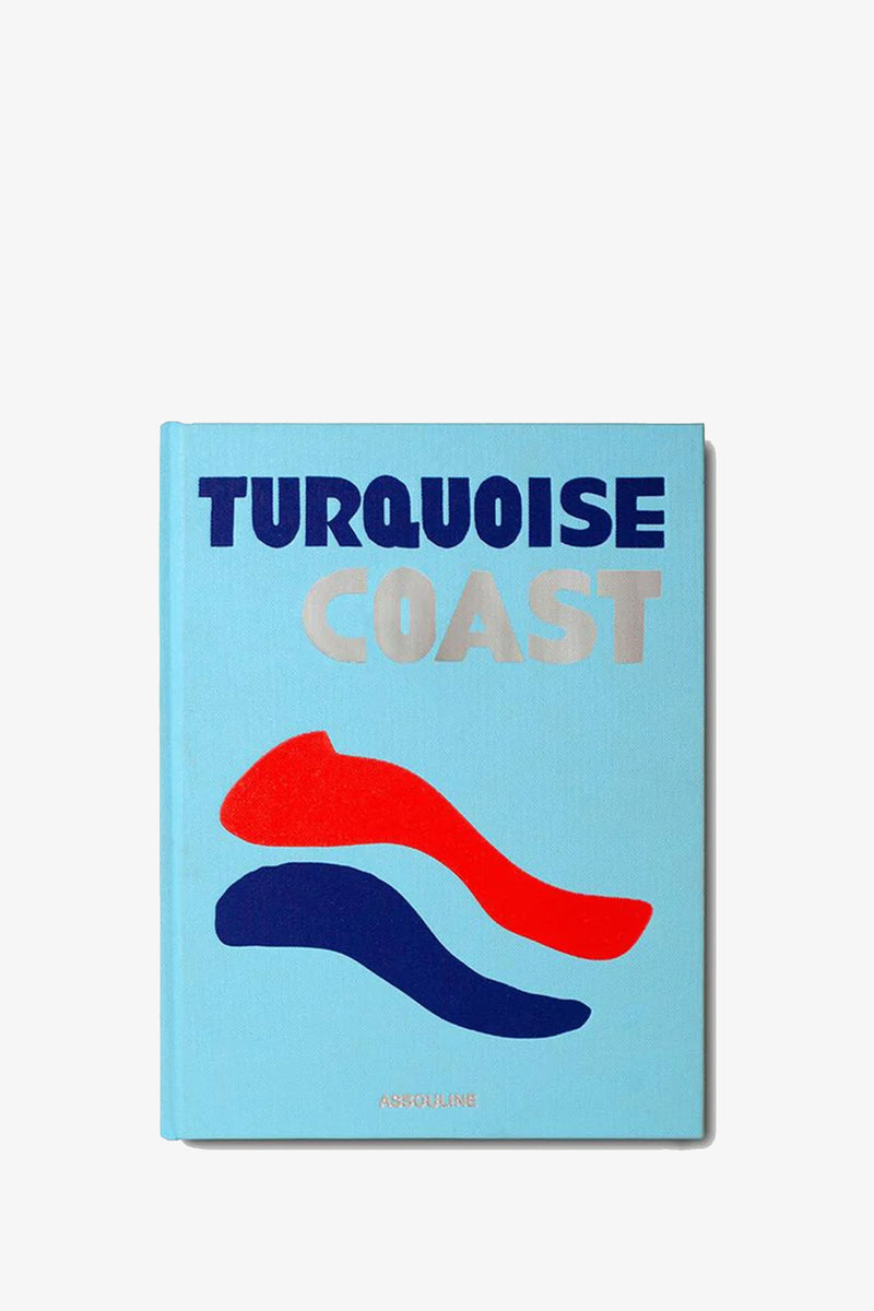 A light blue Assouline Turquoise Coast Book featuring the title in bold lettering and abstract red and blue wave shapes beneath the text.
