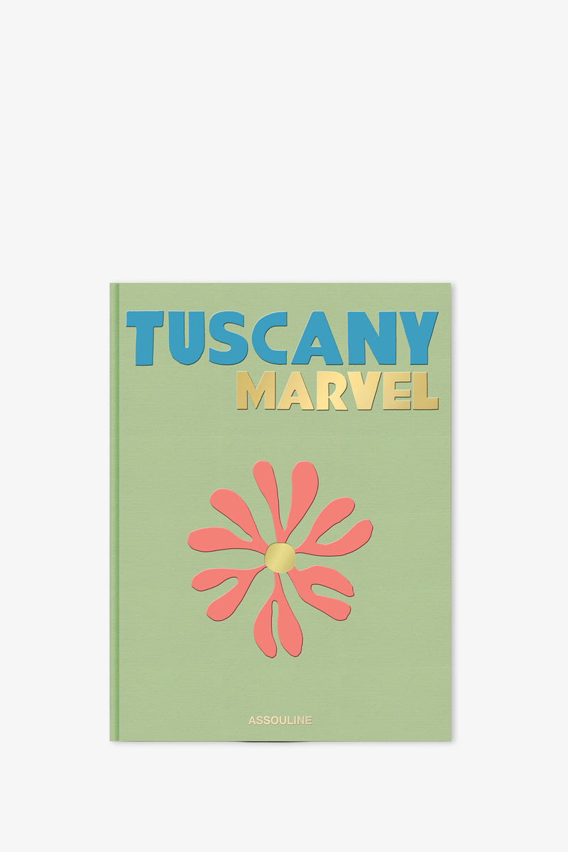 A green cover adorns the Assouline Tuscany Marvel Book, featuring its title in blue and gold letters, a stylized red flower at the center, and "Assouline" displayed at the bottom.