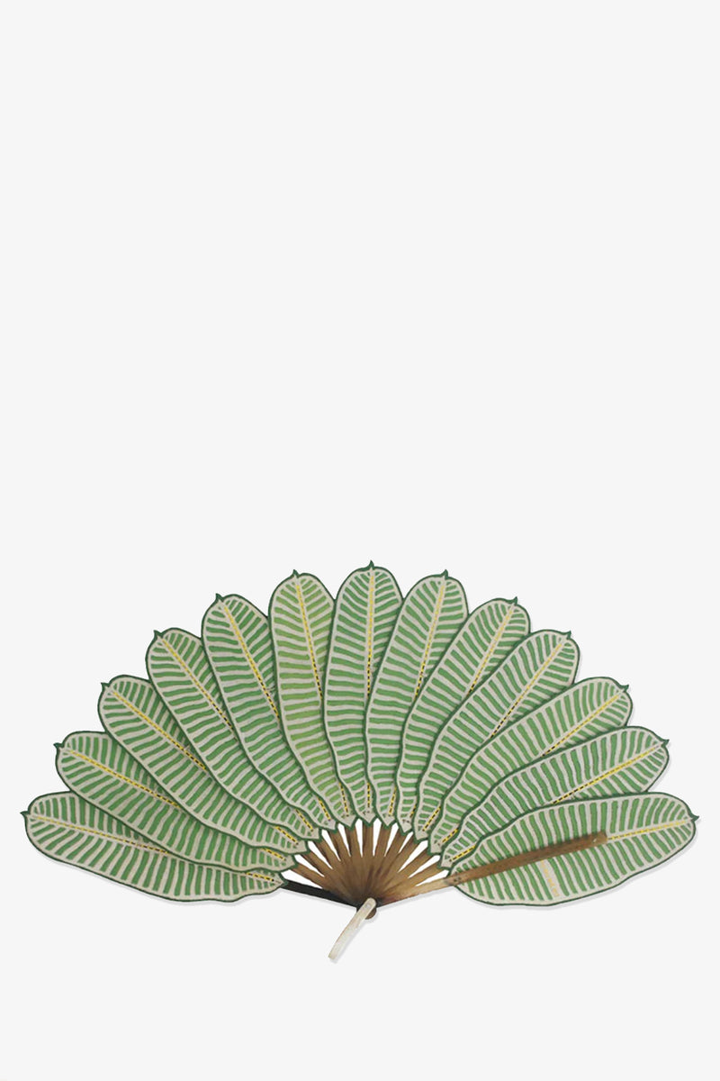 The Pu Bu Me Su Banana Leaf Fan is a handheld fan with green and white striped, leaf-shaped blades in a semi-circle and a brown handle, resembling tropical leaves, set against a plain white background.