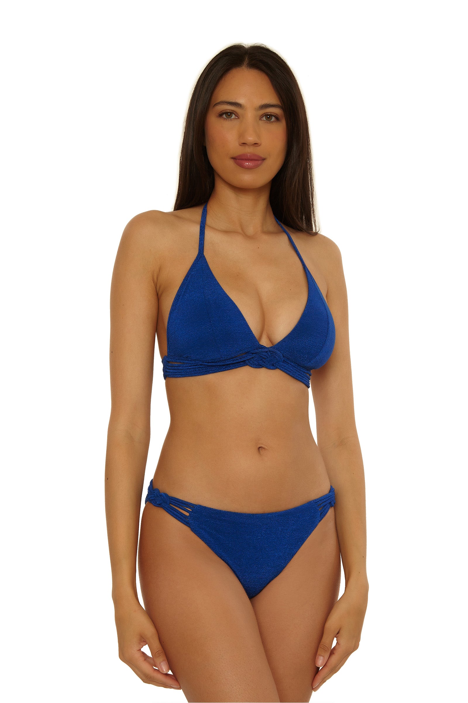 A woman with long dark hair models the Crete Crepe Braided Halter Top in blue, posing against a plain white background and looking at the camera with a neutral expression.