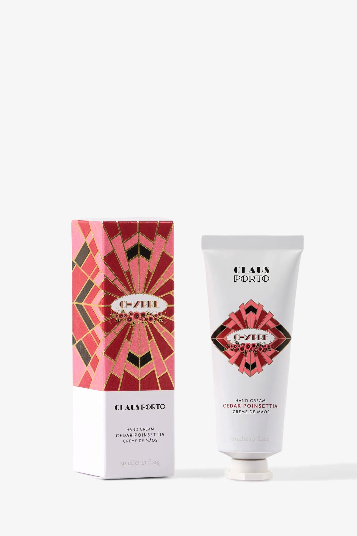 A tube of Claus Porto Chypre Hand Cream and its decorative pink and red box featuring geometric patterns, labeled Chypre.